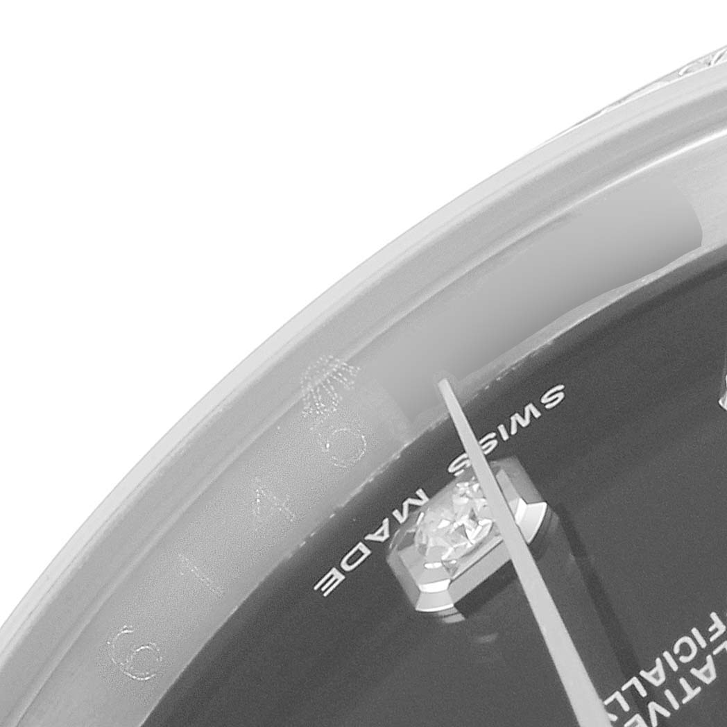 The image shows a close-up of the dial and seconds hand of a Rolex Datejust 116244 Men
s Stainless Steel Black Dial 116244 Men
s Stainless Steel Black Dial watch, highlighting "Swiss Made" text and a diamond marker.