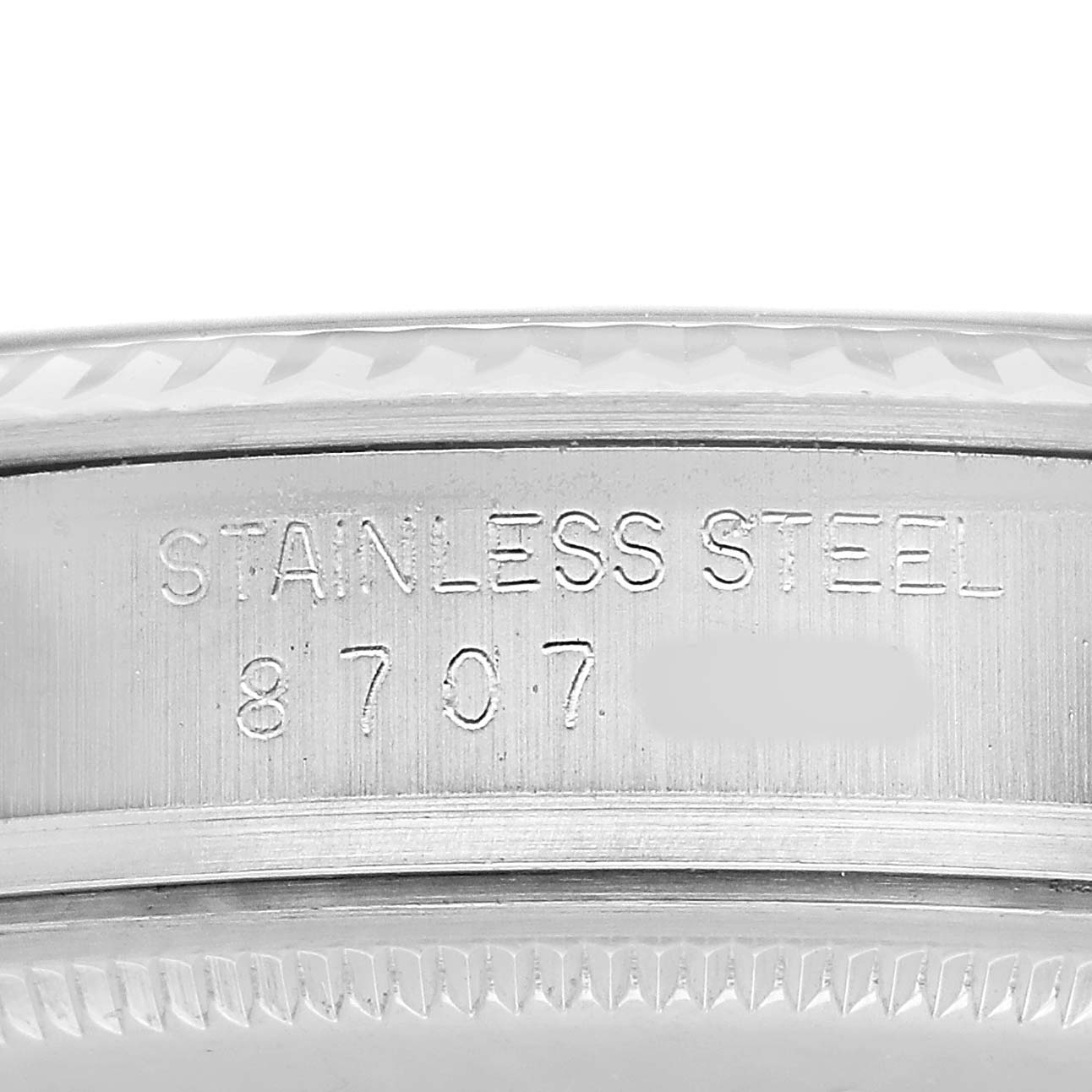The image shows a close-up of the side of a Rolex Datejust 16014 Men's Steel and Gold (two tone) Blue Dial, highlighting the stainless steel engraving and model number.