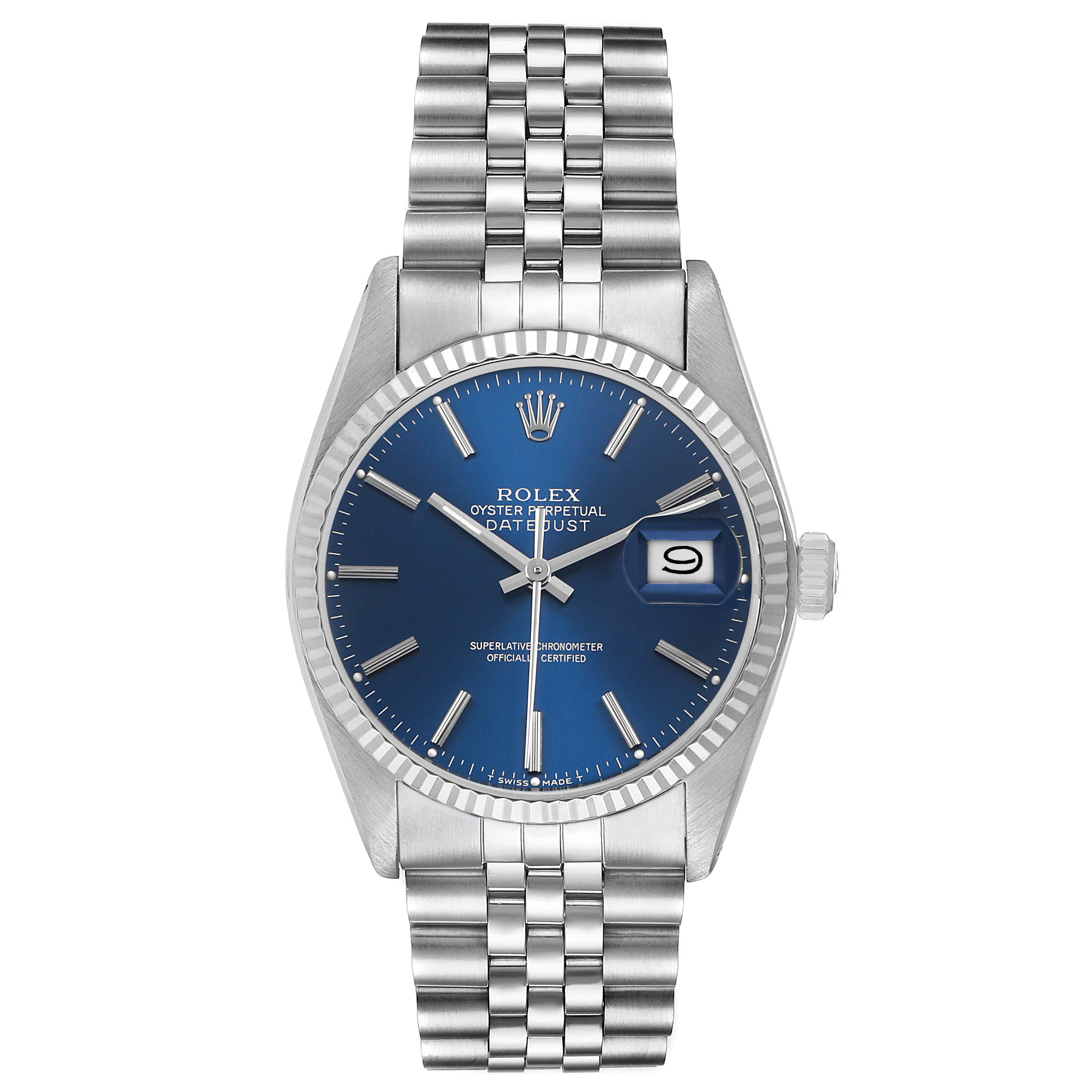 The Rolex Datejust 16014 Men's Steel and Gold (two tone) Blue Dial watch is shown from a top-down angle, highlighting its blue dial, jubilee bracelet, and date window.