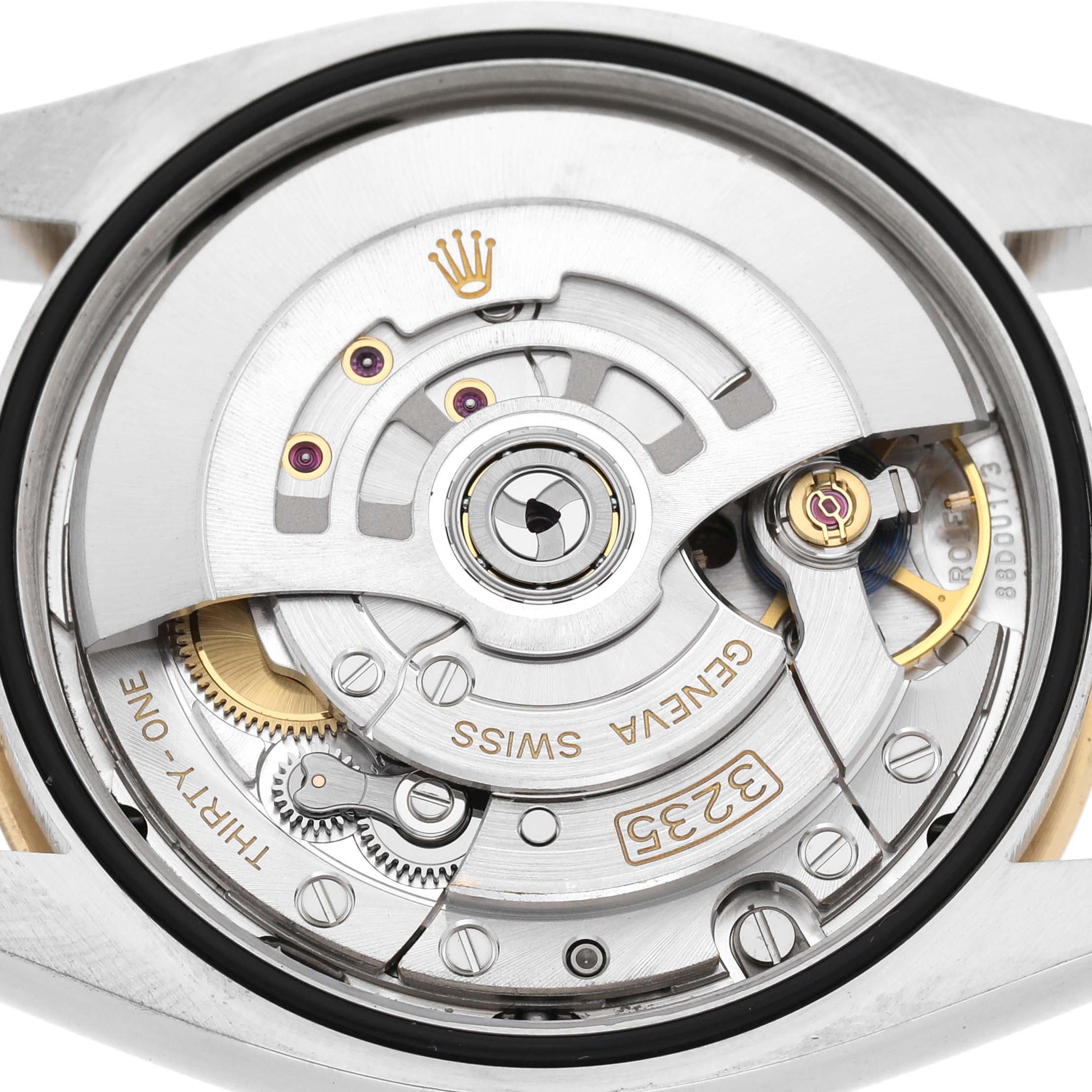 The image shows the movement of a Rolex Datejust 126233 Men's Steel and Gold (two tone) Champagne Dial watch, featuring the intricate inner mechanisms and components from a rear angle.