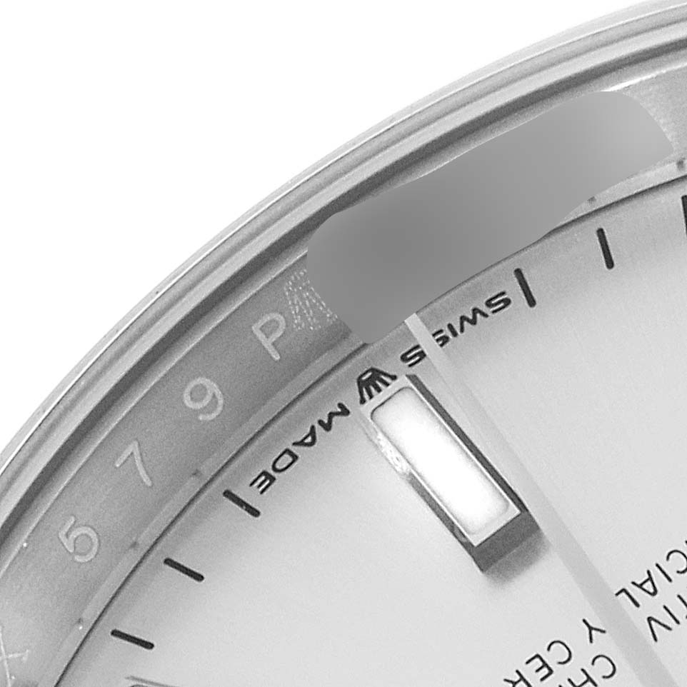 The image shows a close-up of the dial and edge of the Rolex Datejust 126200 Men's Stainless Steel Silver Dial 126200 Men's Stainless Steel Silver Dial watch, highlighting the "Swiss Made" text and part of the markers.