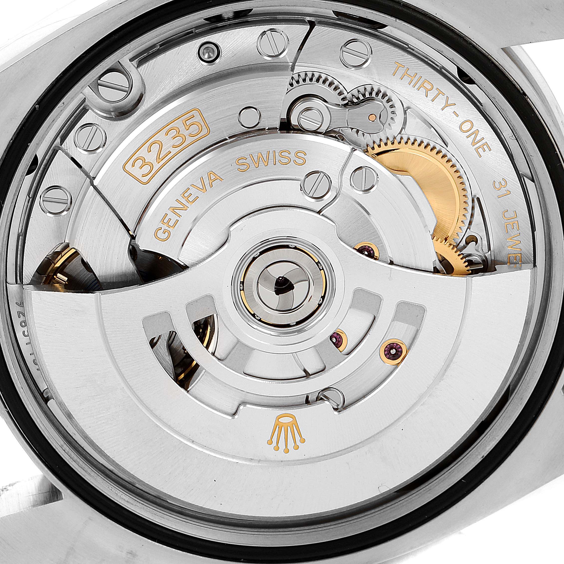 The image shows the movement mechanism of a Rolex Datejust 126200 Men's Stainless Steel Silver Dial 126200 Men's Stainless Steel Silver Dial watch from a back angle, focusing on the intricate internal parts.
