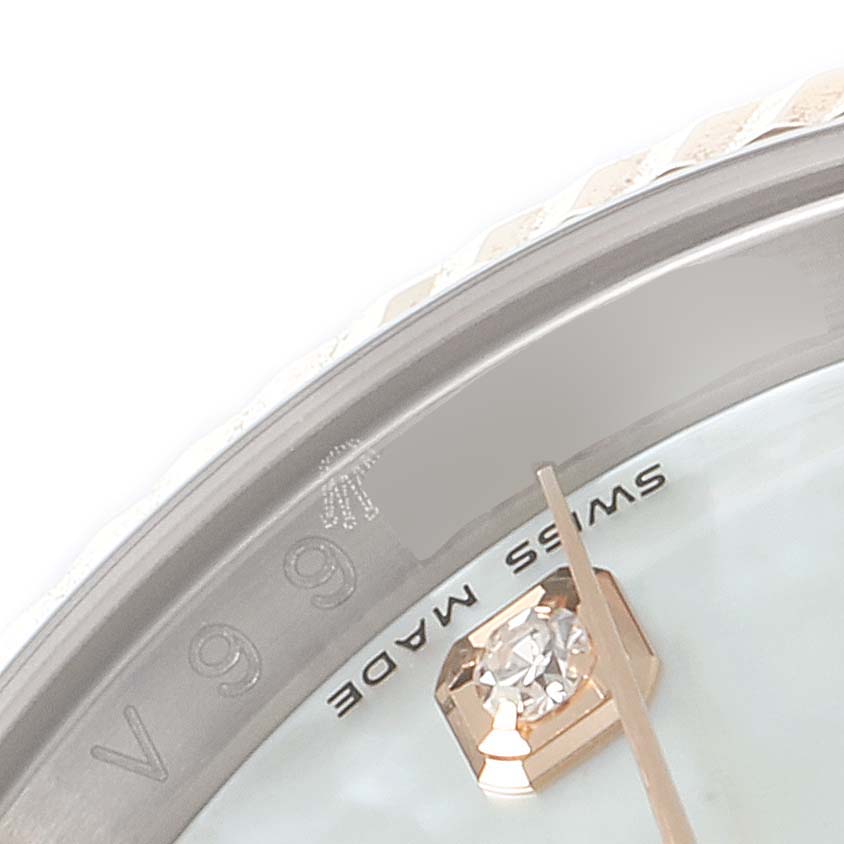 This close-up image shows the dial and partial bezel of a Rolex Datejust 116231 Men's Steel and Gold (two tone) Mother of Pearl Dial 116231 Men's Steel and Gold (two tone) Mother of Pearl Dial watch, highlighting the "Swiss Made" text and a diamond marker.