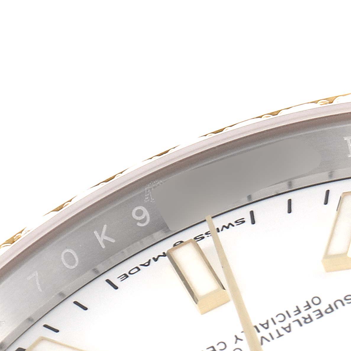 The image shows a close-up angle of the dial and inner bezel of the Rolex Datejust 126283 Men's Steel and Gold (two tone) White Dial 126283 Men's Steel and Gold (two tone) White Dial watch, highlighting part of the serial number and markers.