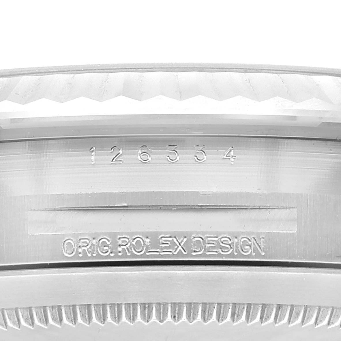 This image displays a close-up of the engraved serial number and "Orig. Rolex Design" on the Datejust 41 model by Rolex.