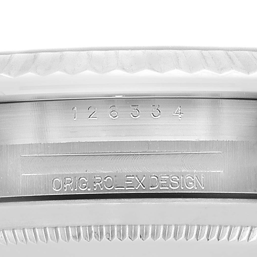 The image shows a close-up of the case side serial number and engraved text on a Rolex Datejust 41 126334 Men
s Stainless Steel Green Dial 126334 Men
s Stainless Steel Green Dial watch.