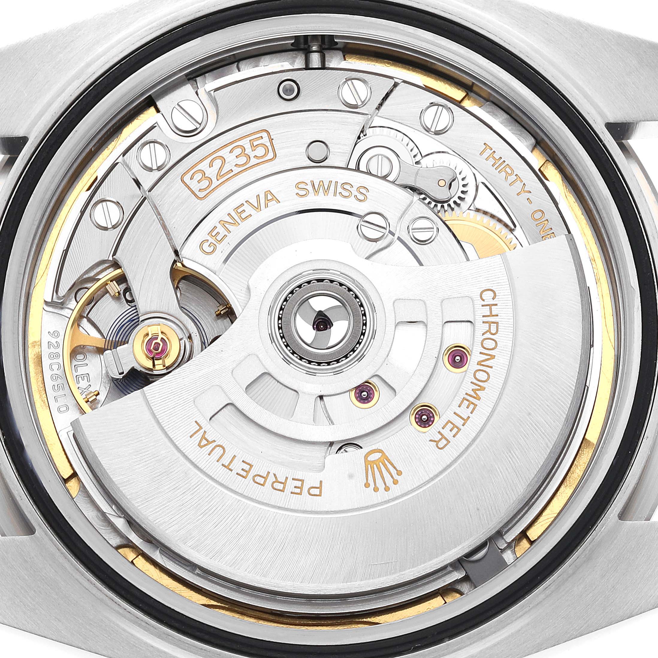 This is a close-up view of the Rolex Datejust 41 126334 Men
s Stainless Steel Green Dial 126334 Men
s Stainless Steel Green Dial
s movement mechanism, showcasing the intricate inner workings.