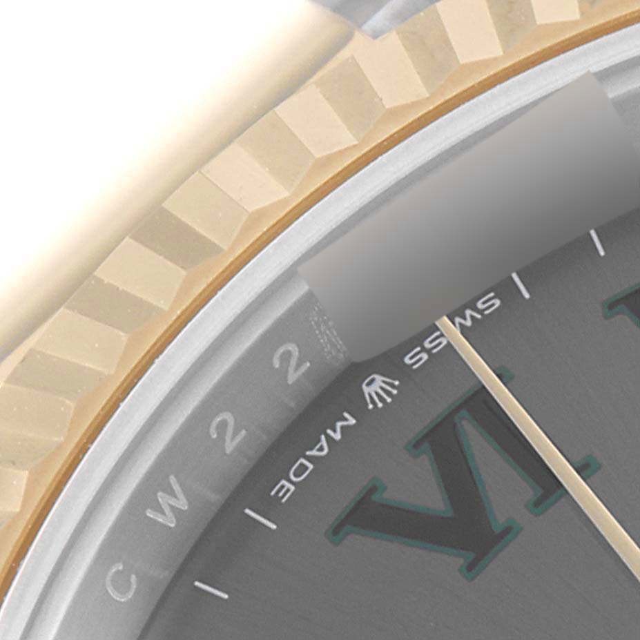 This is a zoomed-in view of the bezel and part of the dial of the Rolex Datejust 41 126333 Men's Steel and Gold (two tone) Grey Dial 126333 Men's Steel and Gold (two tone) Grey Dial watch.