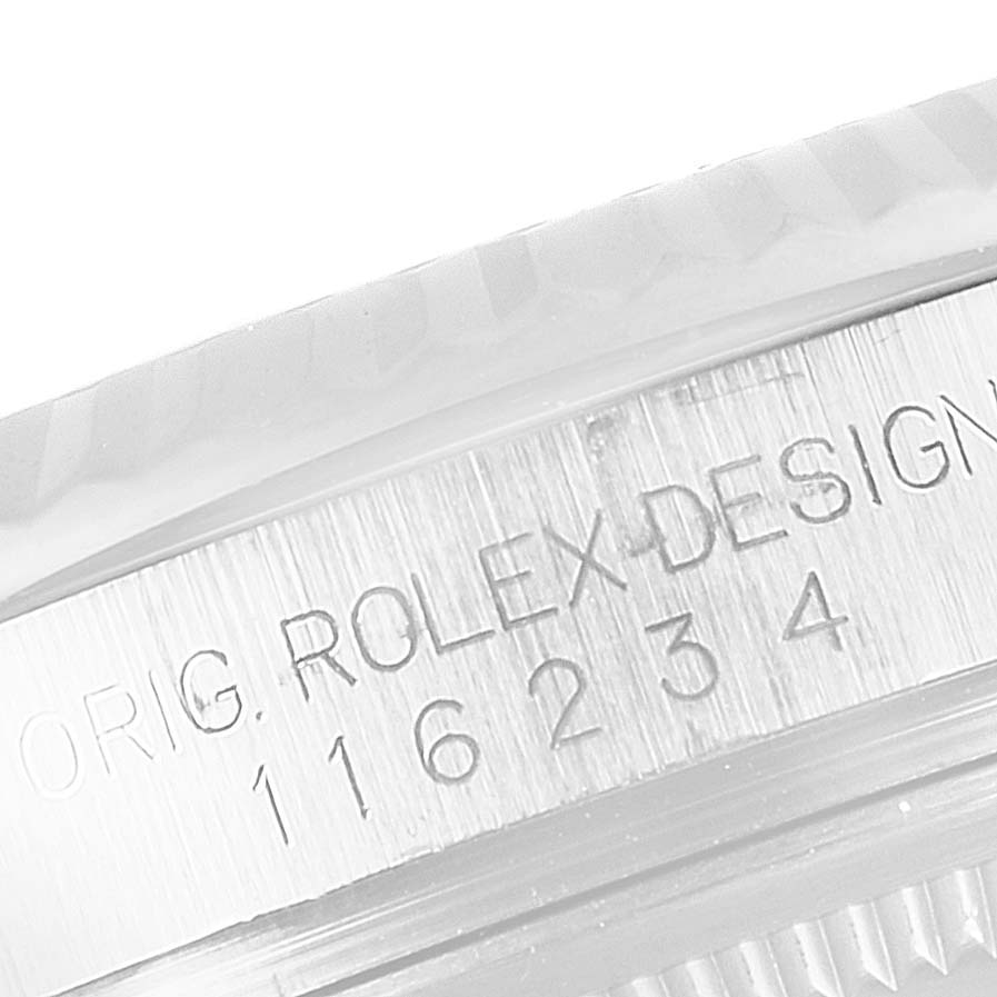 The image shows a close-up of the engraved serial numbers and "Orig Rolex Design" inscription on a Rolex Datejust 116234 Men's Stainless Steel Silver Dial 116234 Men's Stainless Steel Silver Dial watch.