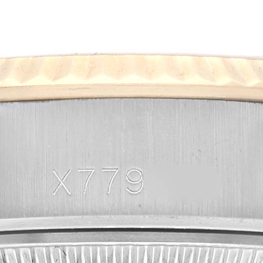 The close-up image shows the serial number on the side of a Rolex Datejust 69173 Women's Steel and Gold (two tone) Champagne Dial 69173 Women's Steel and Gold (two tone) Champagne Dial watch bezel.