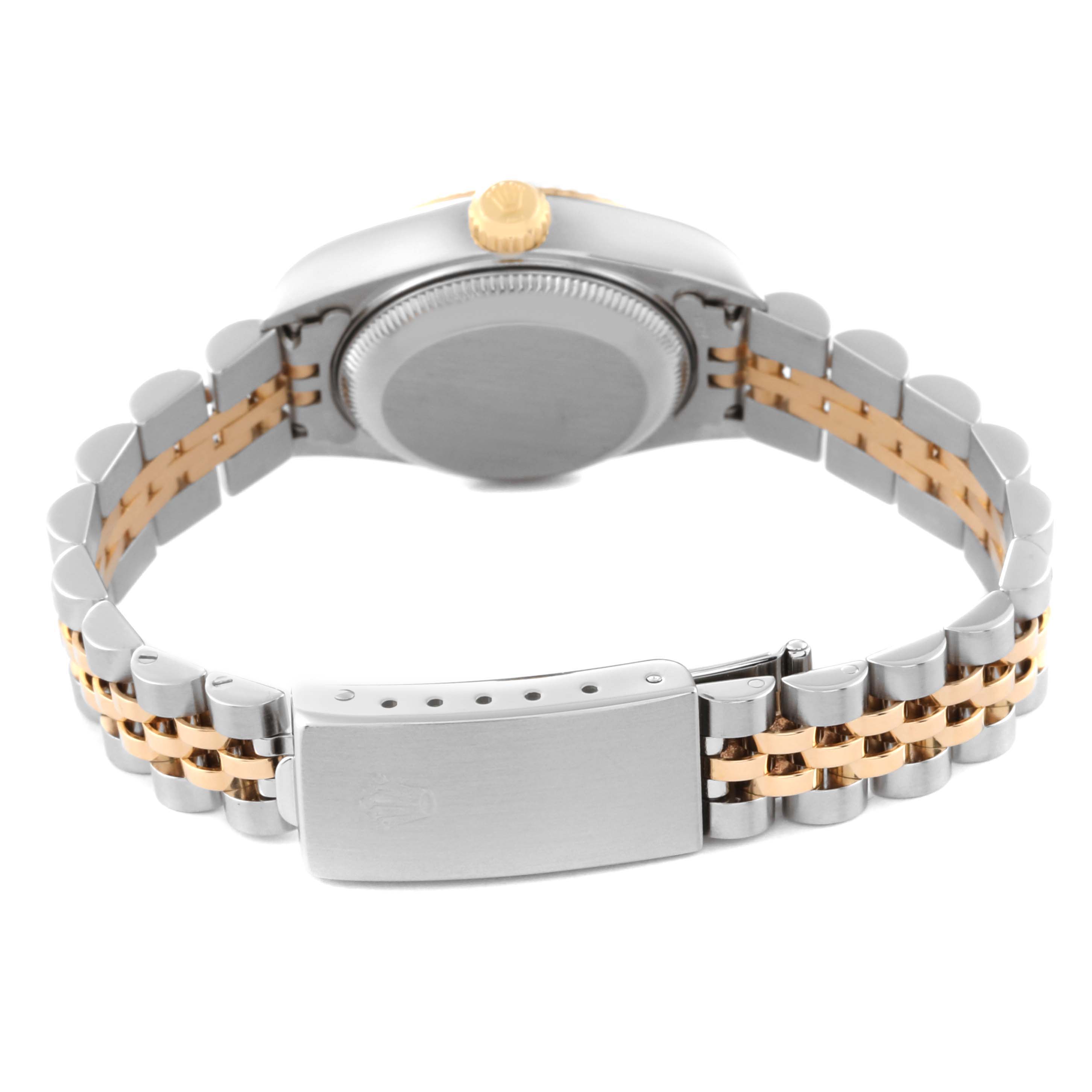 The image shows the back view of a Rolex Datejust 79173 Women's Steel and Gold (two tone) Beige Dial 79173 Women's Steel and Gold (two tone) Beige Dial with a two-tone bracelet and the clasp of the watch.