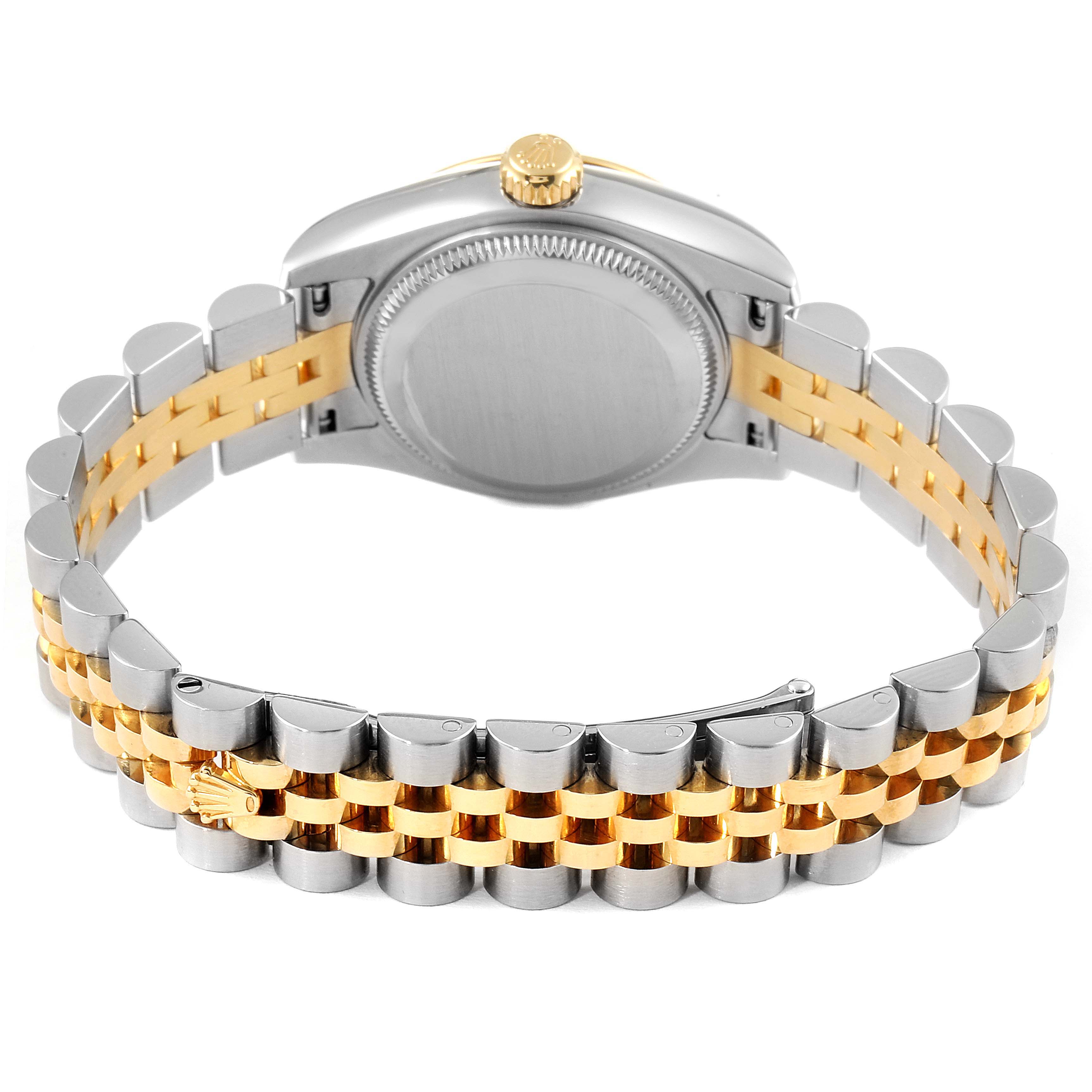 The image shows the back of a Rolex Datejust 179173 Women's Steel and Gold (two tone) Mother of Pearl Dial 179173 Women's Steel and Gold (two tone) Mother of Pearl Dial watch with a two-tone metal bracelet and the case back visible.