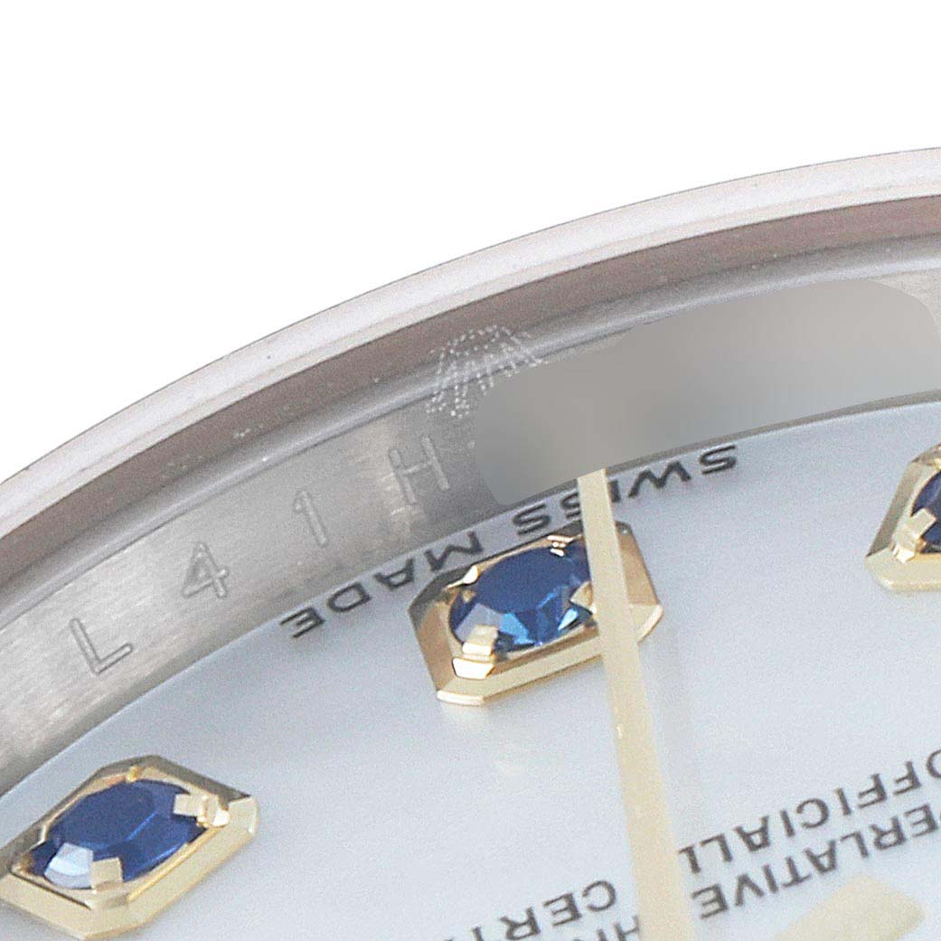 The image shows a close-up of the dial and sapphire-studded hour markers of the Rolex Datejust 179173 Women's Steel and Gold (two tone) Mother of Pearl Dial 179173 Women's Steel and Gold (two tone) Mother of Pearl Dial watch.