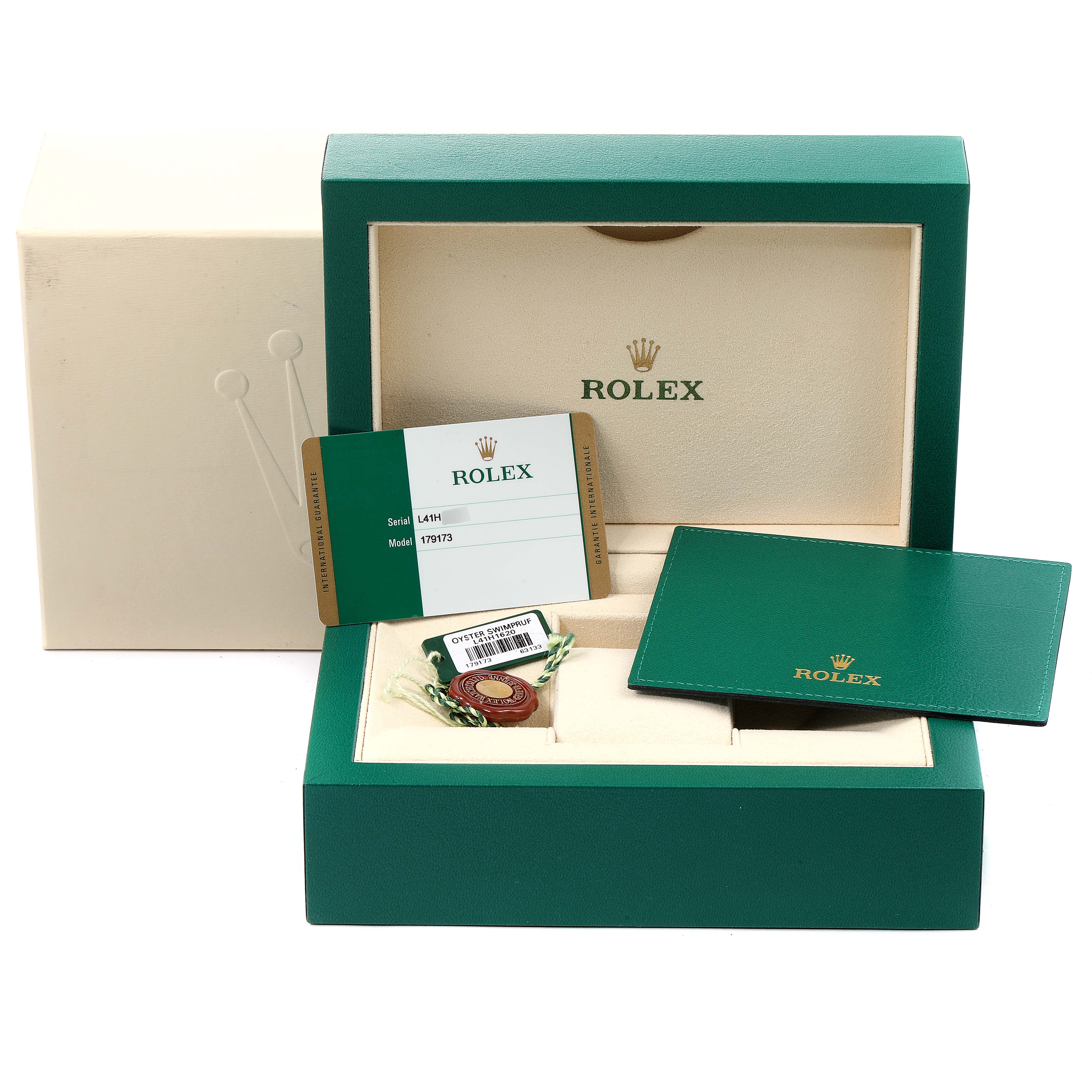 This image shows the box and accessories for a Rolex Datejust 179173 Women's Steel and Gold (two tone) Mother of Pearl Dial 179173 Women's Steel and Gold (two tone) Mother of Pearl Dial, including warranty card, hang tag, manual, and outer box.