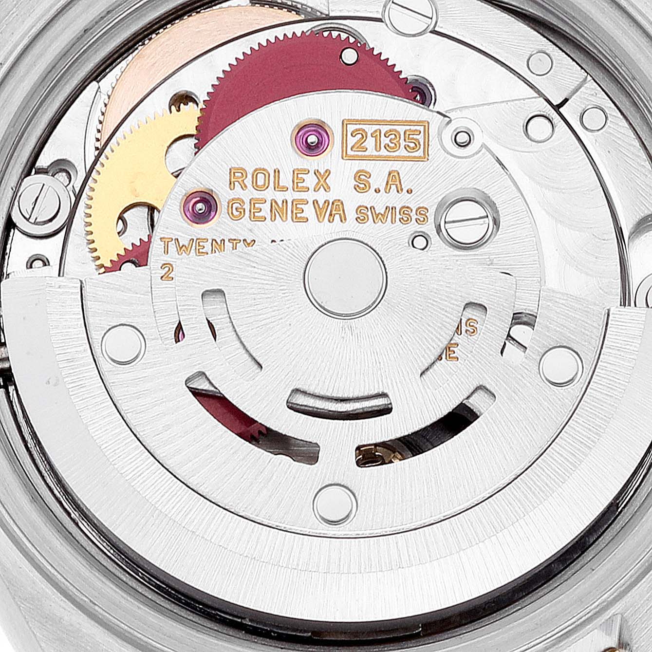 This image shows a close-up of the Rolex Datejust 69173 Women's Steel and Gold (two tone) Grey Dial 69173 Women's Steel and Gold (two tone) Grey Dial movement's internal mechanism, highlighting gears and engravings.