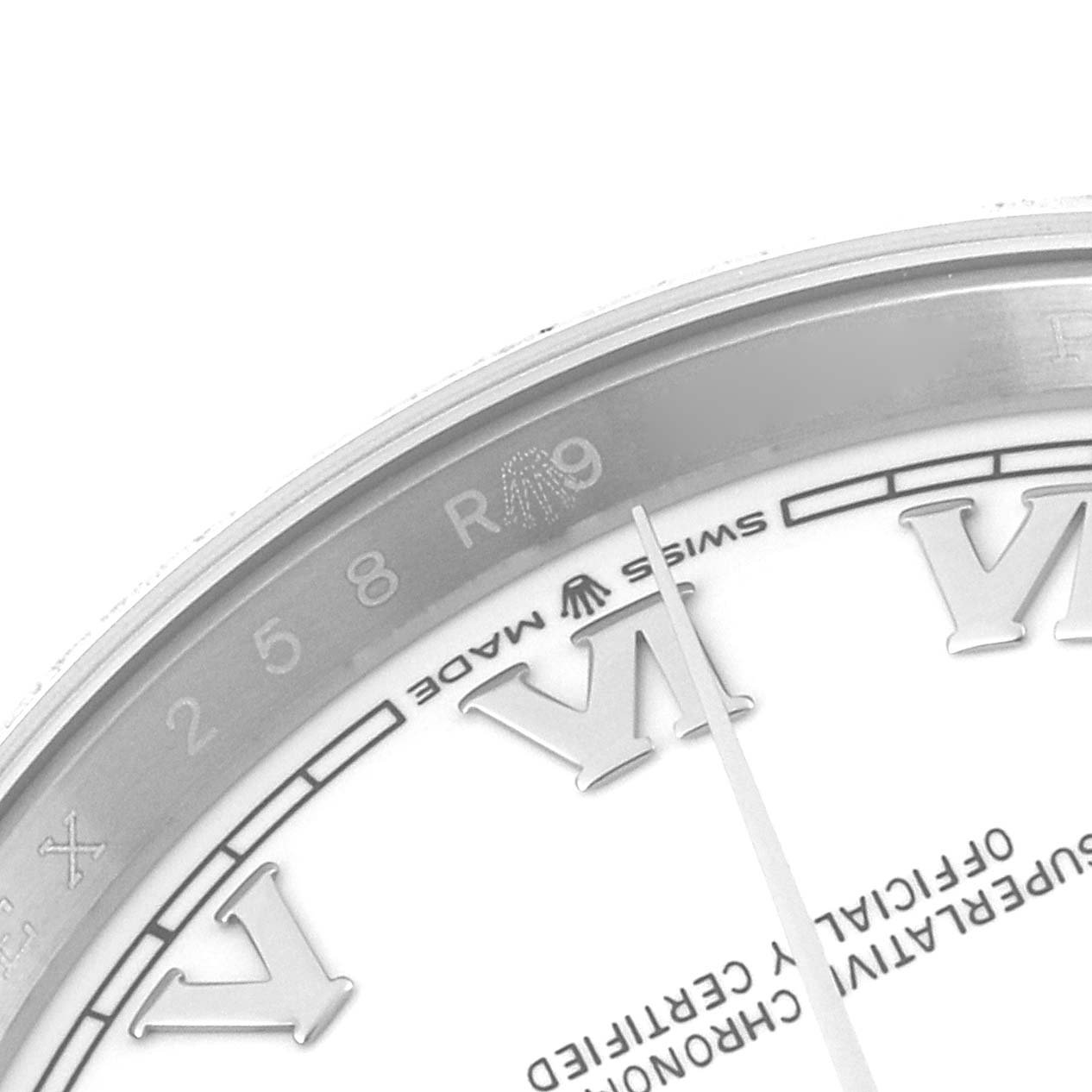 This close-up image shows the dial and part of the bezel of a Rolex Datejust 126200 Men
s Stainless Steel White Dial 126200 Men
s Stainless Steel White Dial watch, highlighting the Roman numerals and "Swiss Made" text.