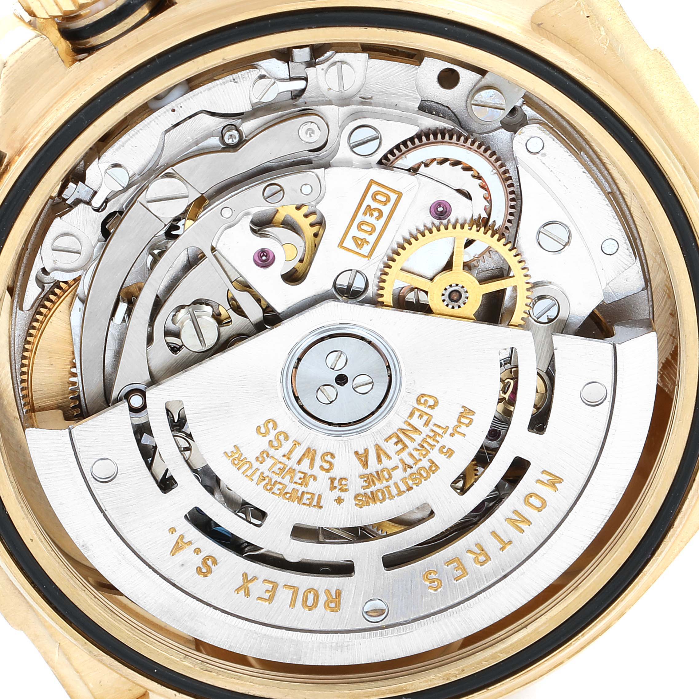 This image shows the intricate movement and internal mechanism of a Rolex Daytona 16518 Men's Yellow Gold White Dial 16518 Men's Yellow Gold White Dial watch from a close-up angle.