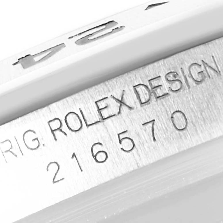 This close-up image shows the model number and "Rolex Design" engraving on the bezel of a Rolex Explorer 216570 Men's Stainless Steel Black Dial 216570 Men's Stainless Steel Black Dial watch.