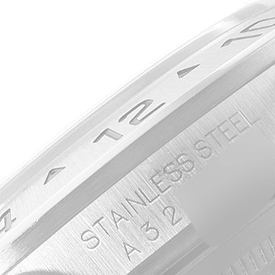 The image shows a close-up angled view of the bezel and the stainless steel part of the Rolex Explorer 16570 Men's Stainless Steel Black Dial 16570 Men's Stainless Steel Black Dial watch.