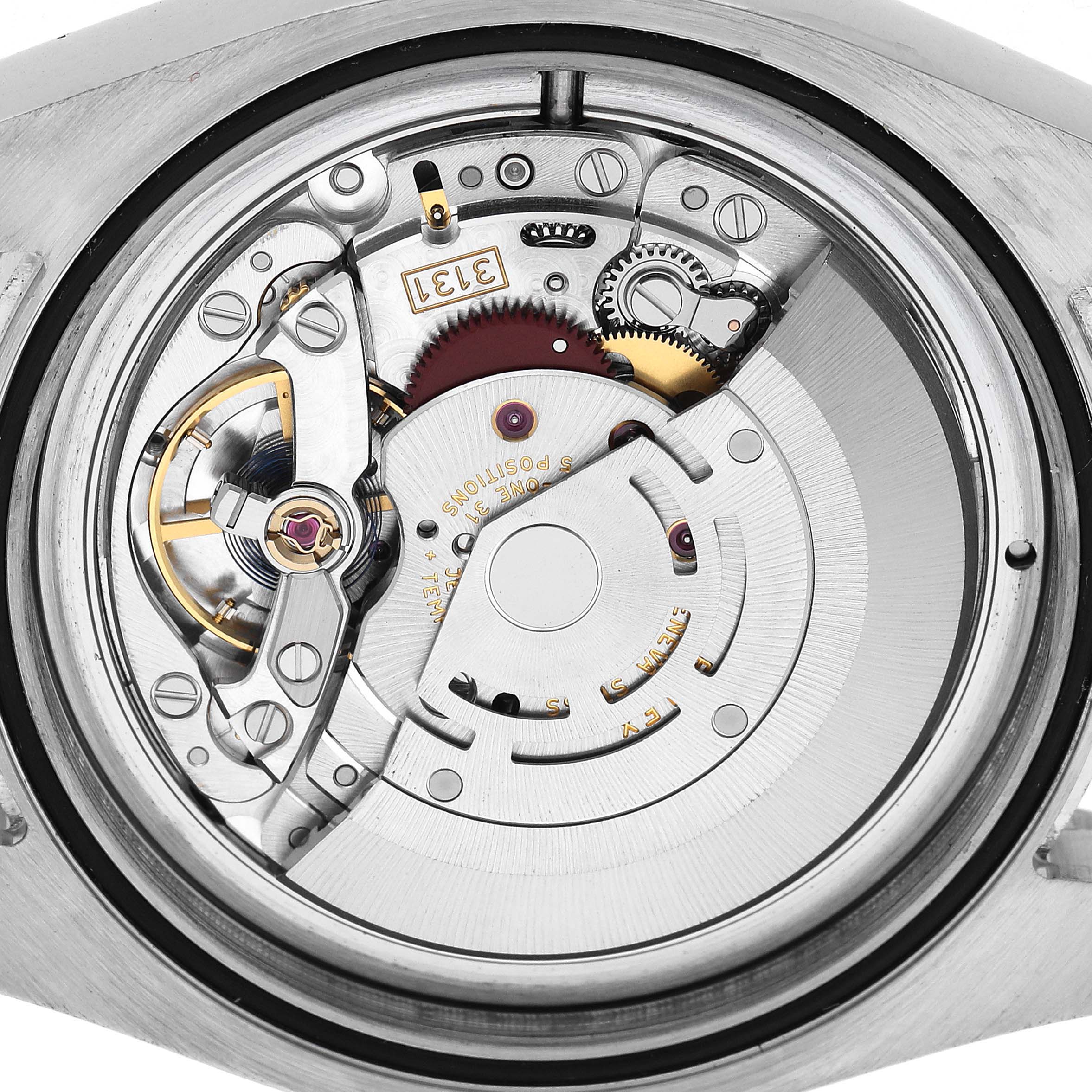The image shows the internal movement of a Rolex Milgauss 116400GV Men's Stainless Steel Black Dial, focusing on gears and components from the back.