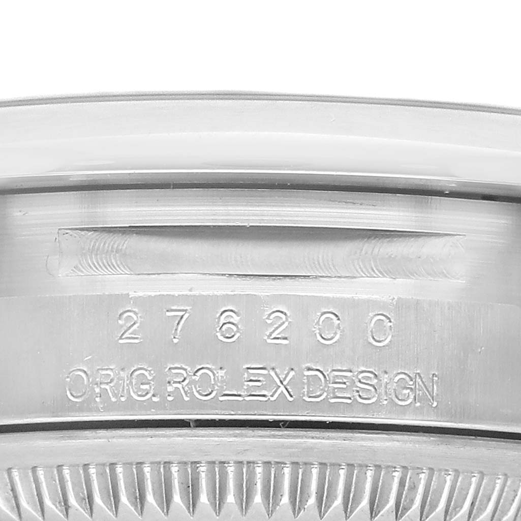 The image shows the side engraving and serial number on the case of a Rolex Oyster Perpetual 276200 Women's Stainless Steel Silver Dial watch.