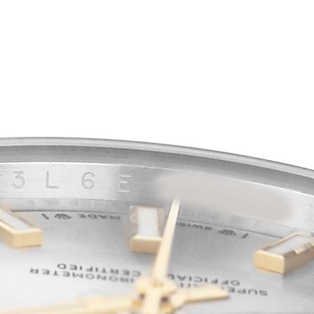 The image shows a close-up of the dial and bezel edge of a Rolex Oyster Perpetual 276200 Women's Stainless Steel Silver Dial watch, focusing on indices and part of the text.