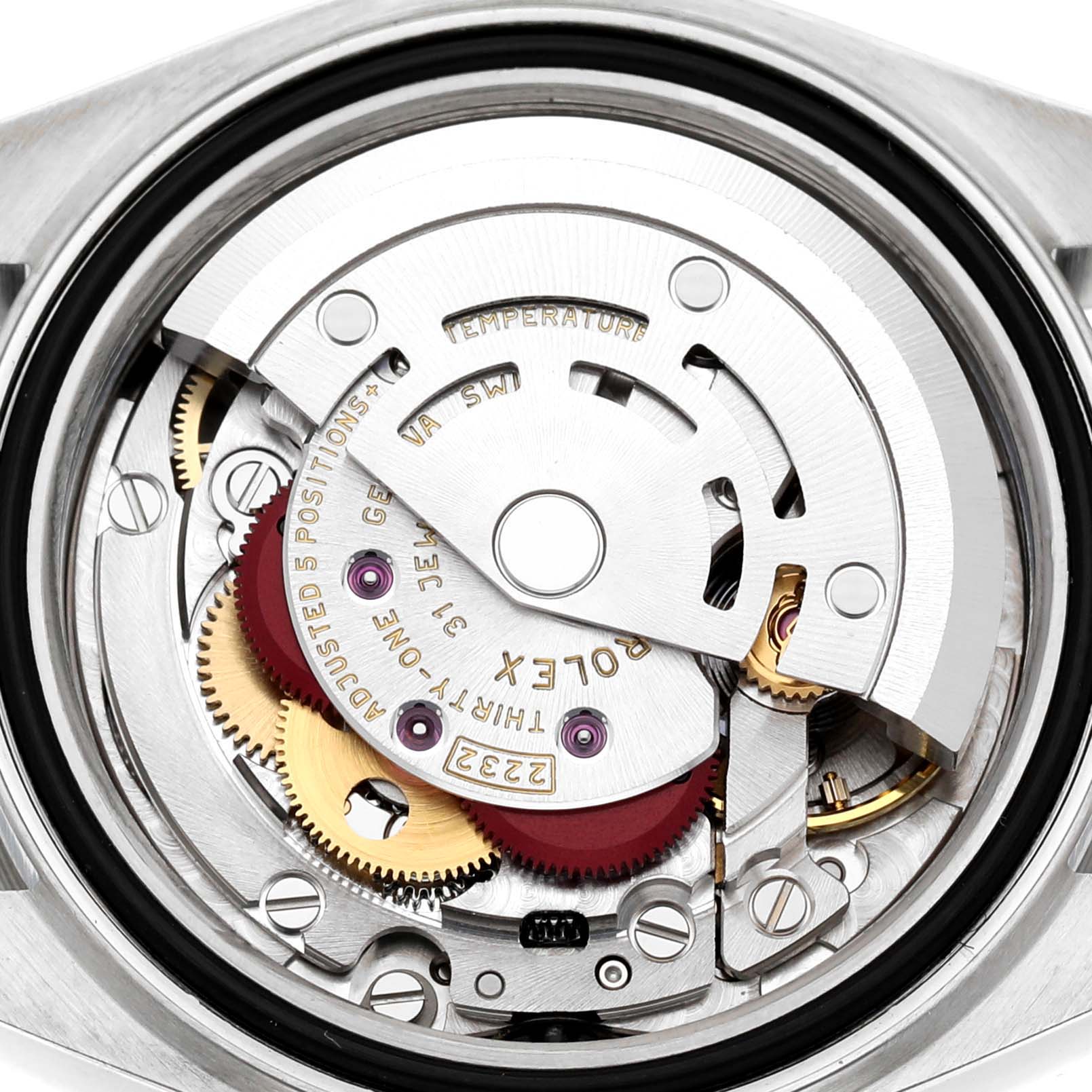 The image shows an inside view of the Rolex Oyster Perpetual 276200 Women's Stainless Steel Silver Dial movement mechanism, highlighting gears and rotor.