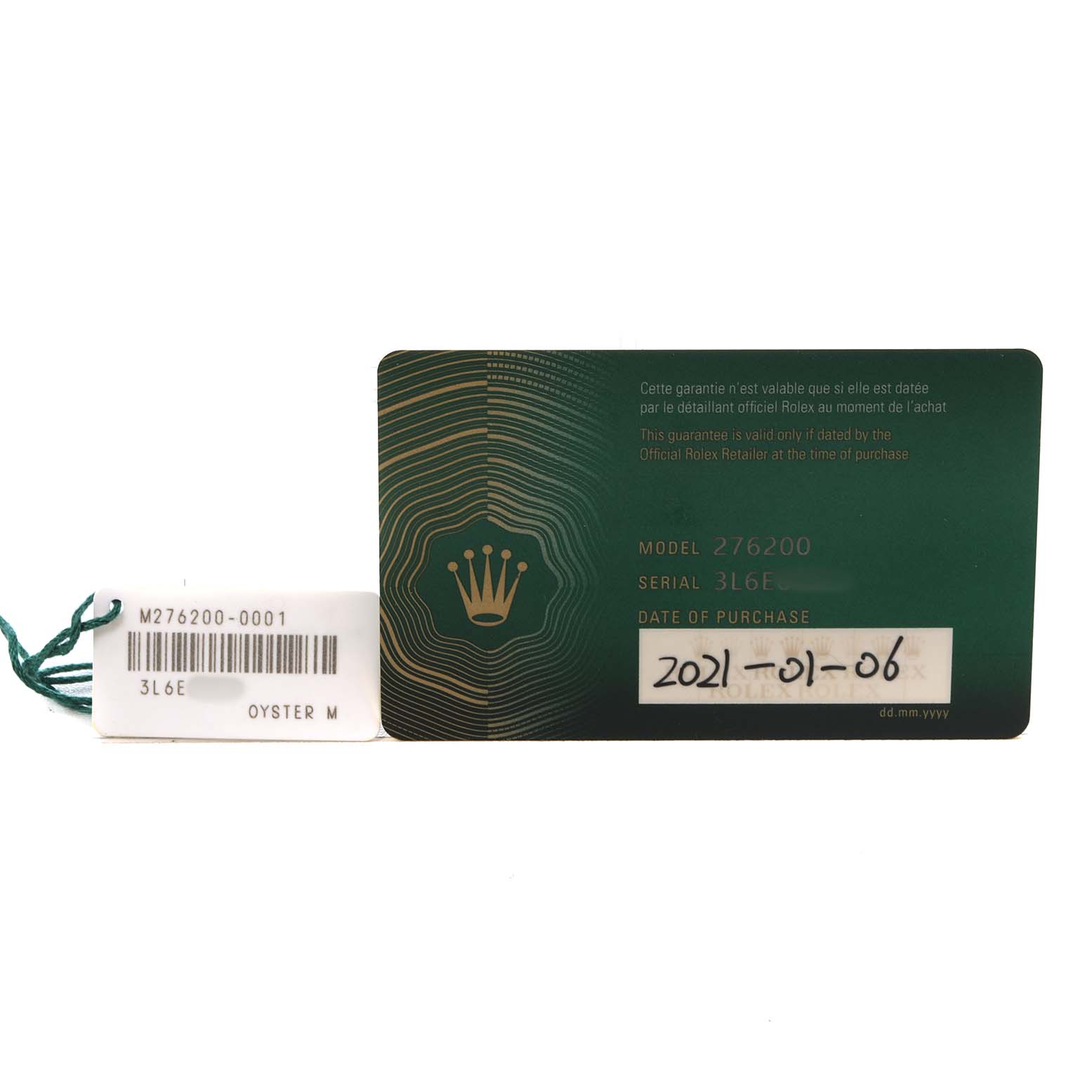 The image shows the warranty card and tag for a Rolex Oyster Perpetual 276200 Women's Stainless Steel Silver Dial watch.