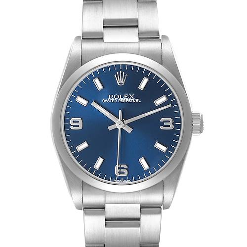 The Rolex Oyster Perpetual 77080 Women's Stainless Steel Blue Dial watch is shown from a front angle, highlighting the blue dial, hour markers, and stainless steel bracelet.
