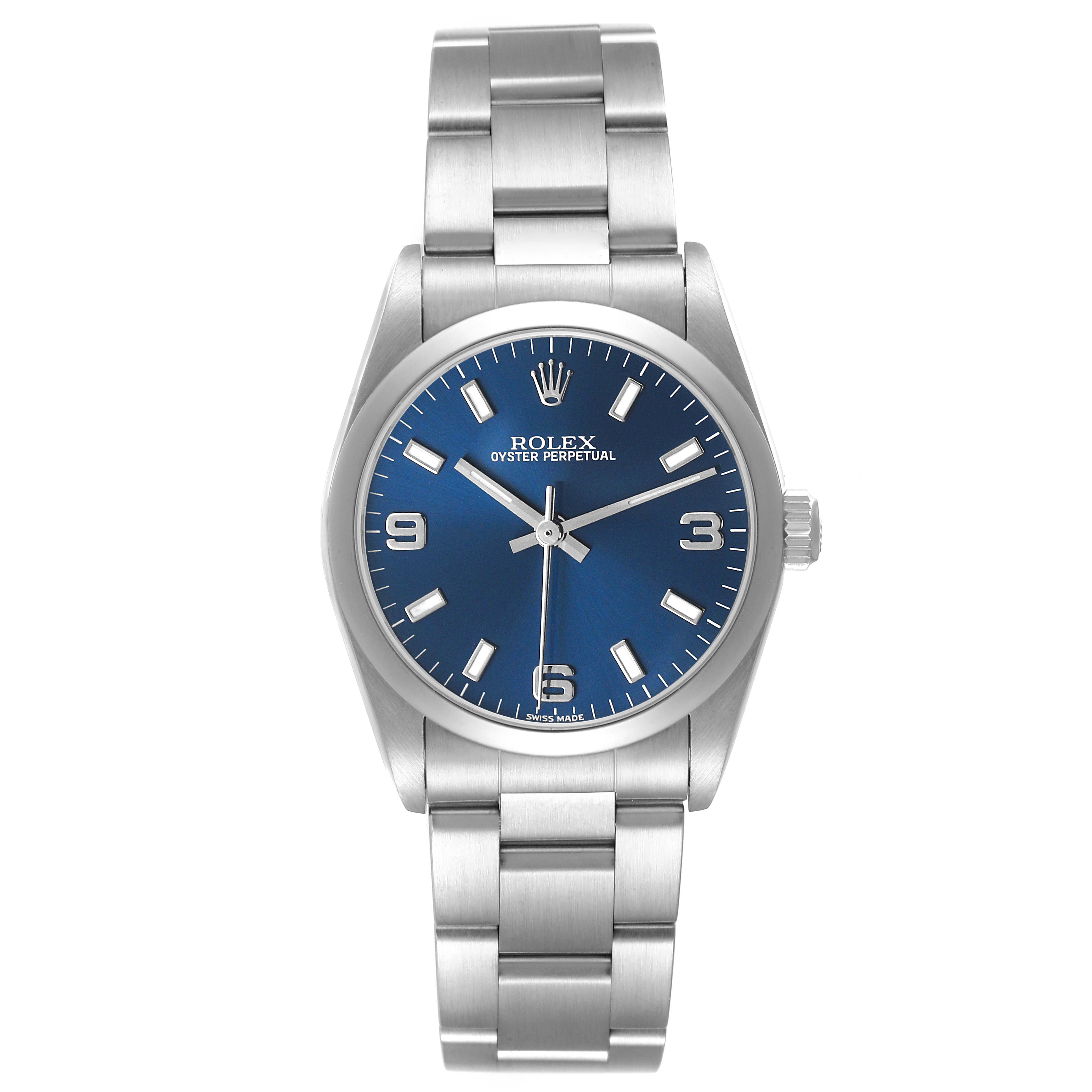 The Rolex Oyster Perpetual 77080 Women's Stainless Steel Blue Dial is shown from a front angle, highlighting the blue dial, hour markers, hands, and stainless steel bracelet.