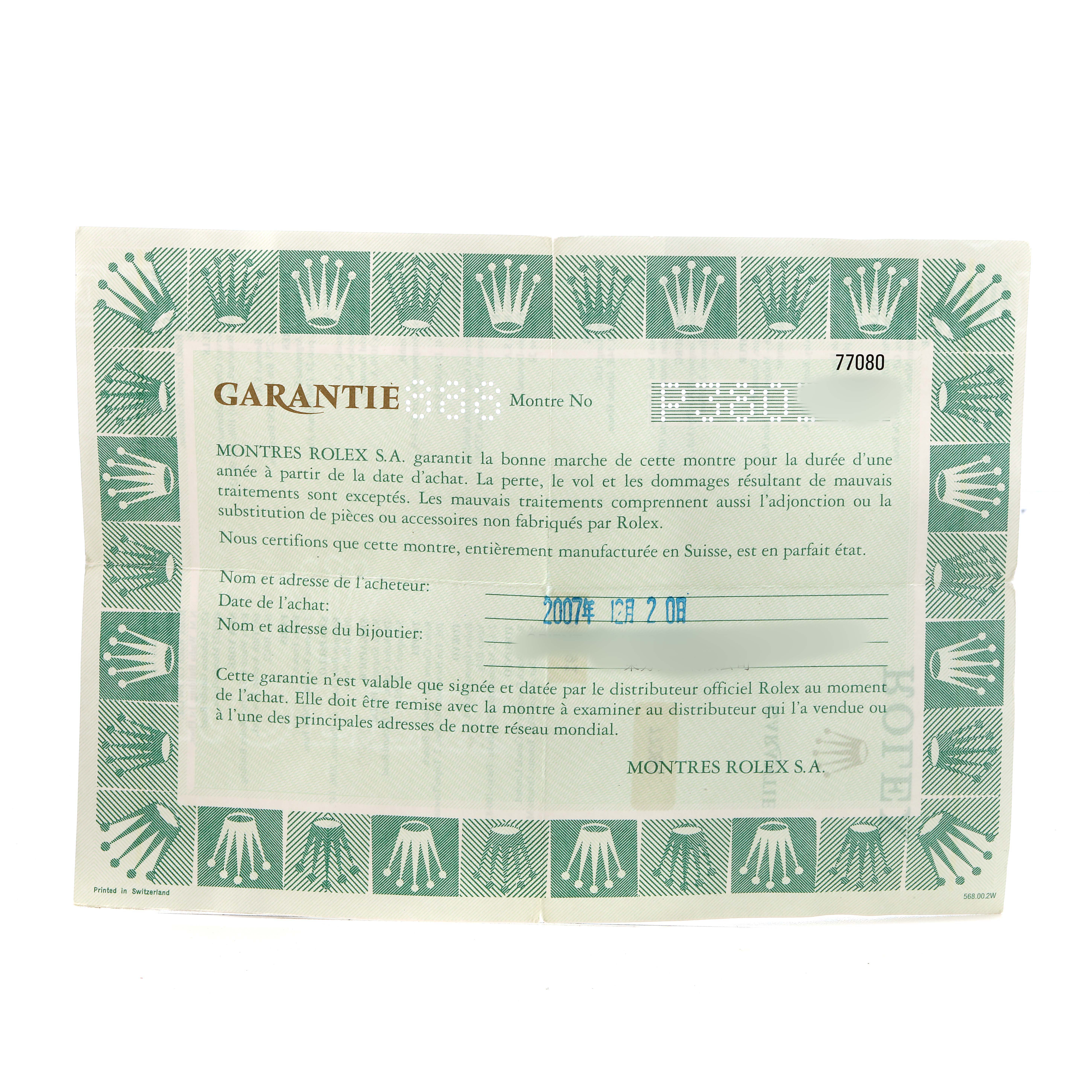 The image shows a warranty card for a Rolex Oyster Perpetual 77080 Women's Stainless Steel Blue Dial watch, featuring French text and a green crown pattern.