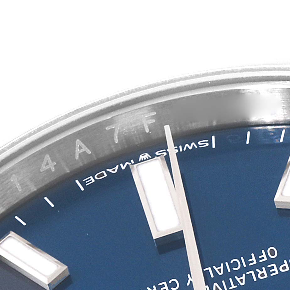 The close-up image shows a partial view of the dial and bezel of the Rolex Oyster Perpetual 124200 Men's Stainless Steel Blue Dial 124200 Men's Stainless Steel Blue Dial watch.