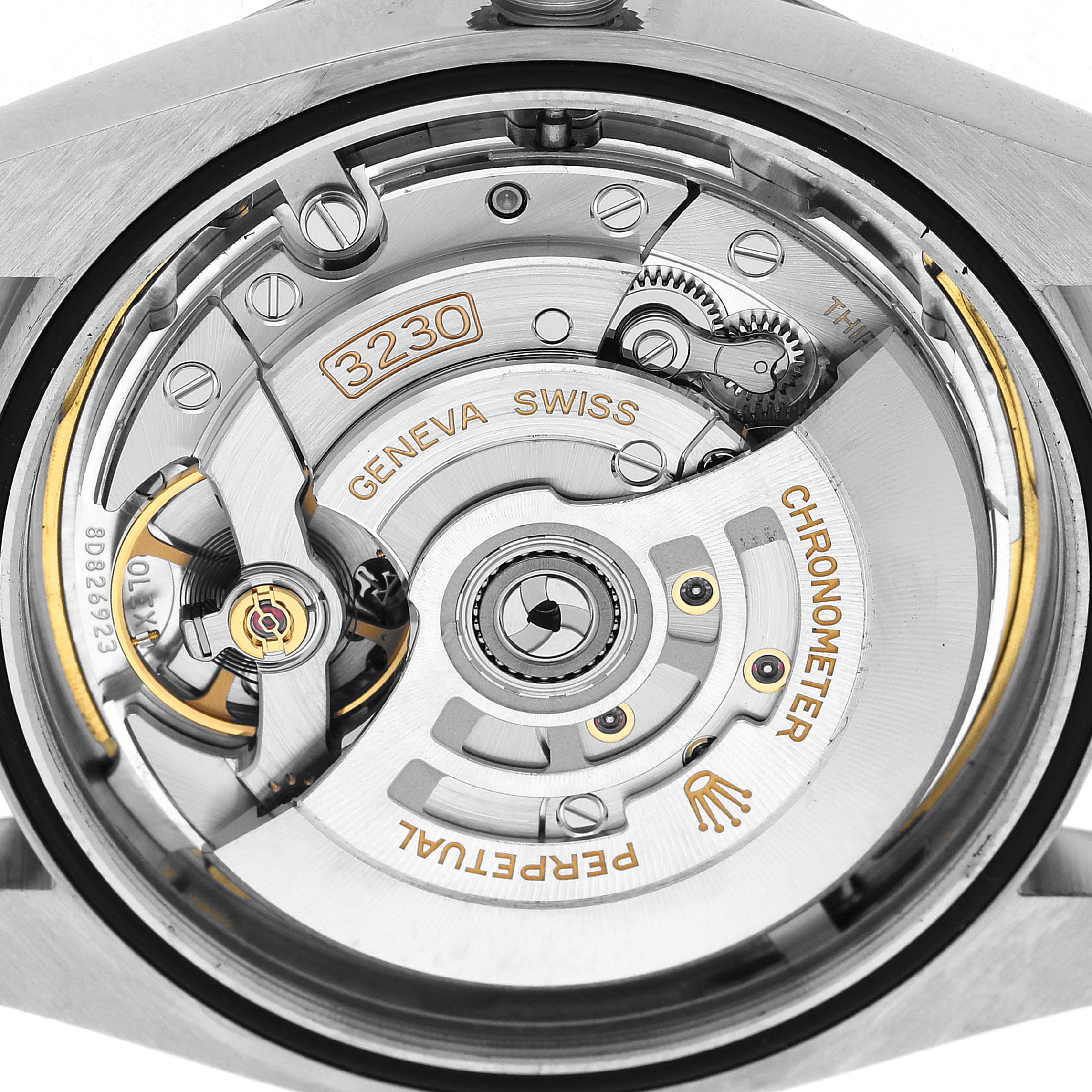 The image shows the backside view of the Rolex Oyster Perpetual 134300 Men's Stainless Steel Green Dial watch, focusing on its intricate movement and internal components.