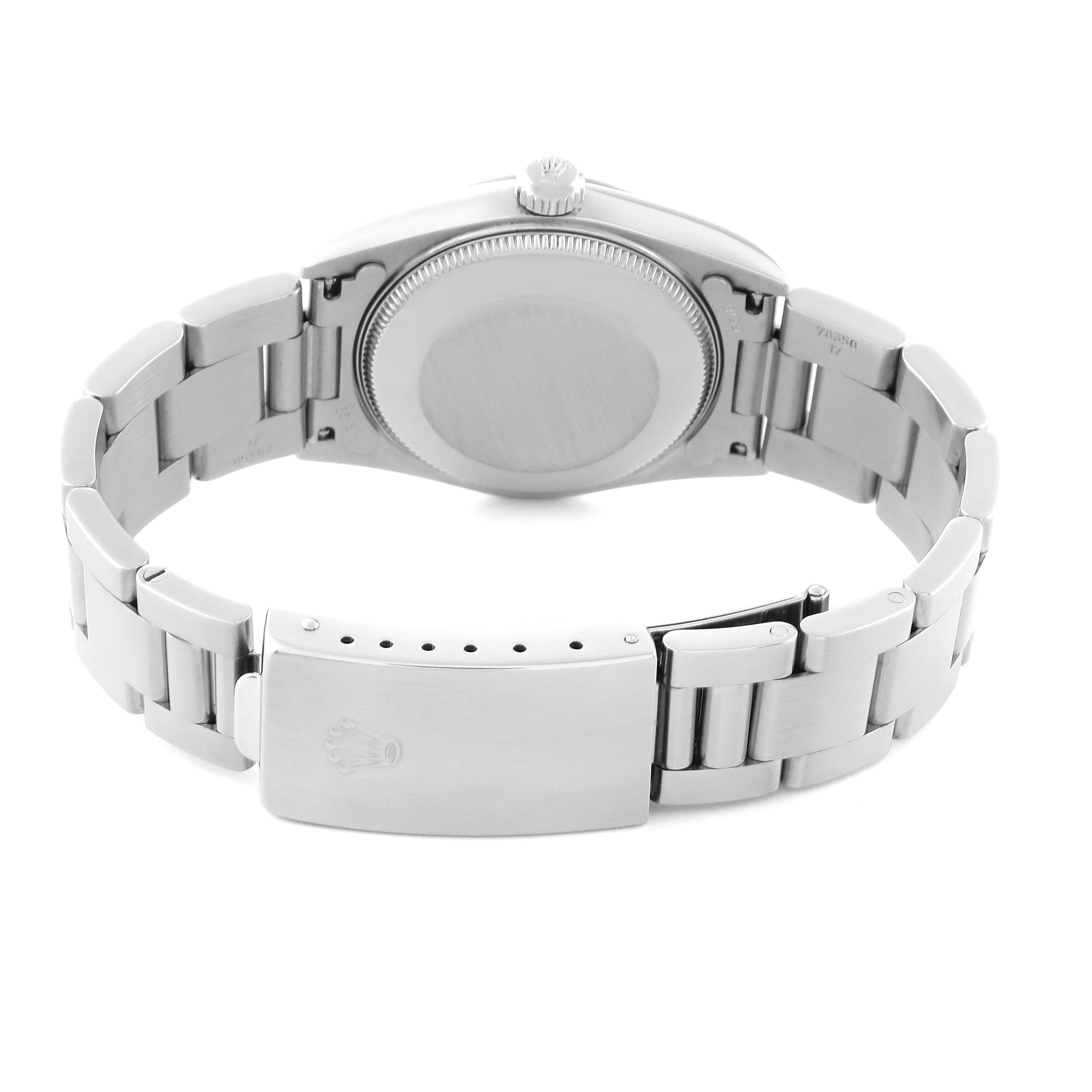 The image shows the back and clasp of a Rolex Mid-Size 77080 Women's Stainless Steel Blue Dial 77080 Women's Stainless Steel Blue Dial watch, highlighting its band and case back.