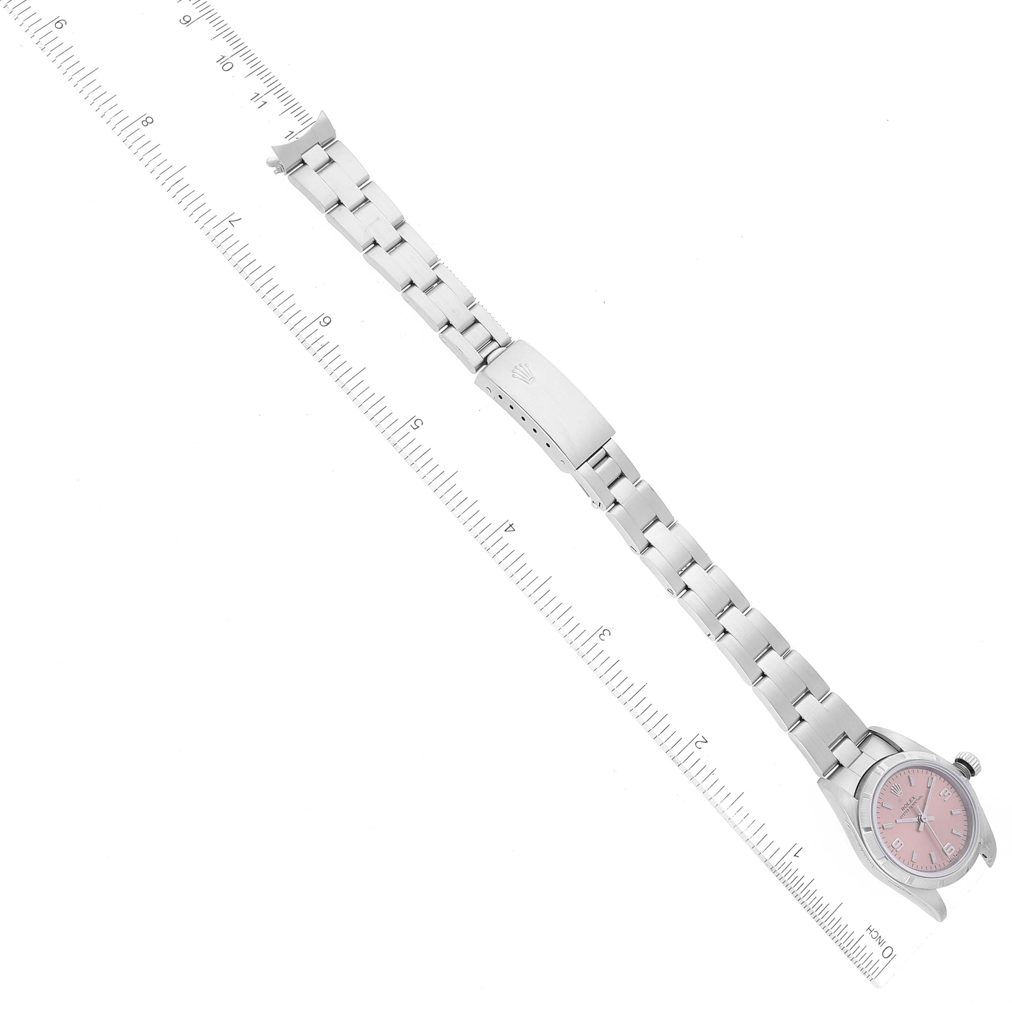 The image shows a Rolex Datejust 76030 Women's Stainless Steel Pink Dial 76030 Women's Stainless Steel Pink Dial model watch lying flat with a metal bracelet and pink dial, measured alongside a ruler for scale.