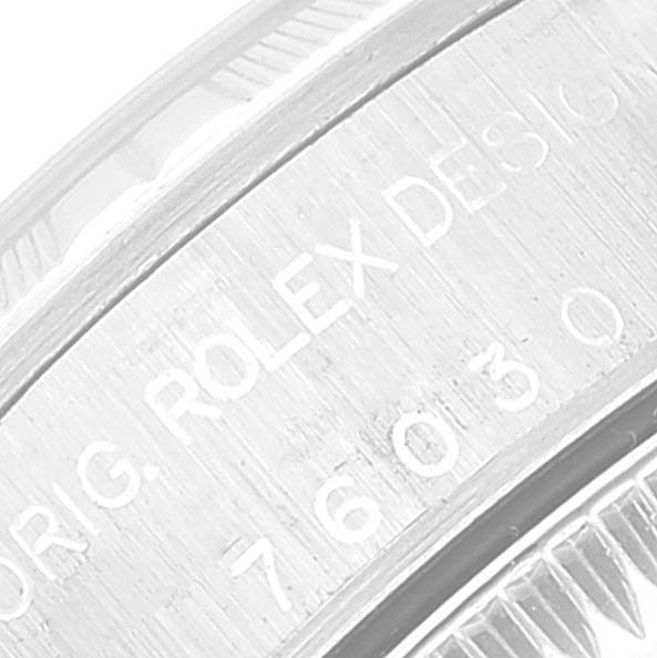 The image is a close-up of the side profile showing the engraved text on the bezel of a Rolex Datejust 76030 Women's Stainless Steel Pink Dial 76030 Women's Stainless Steel Pink Dial watch.