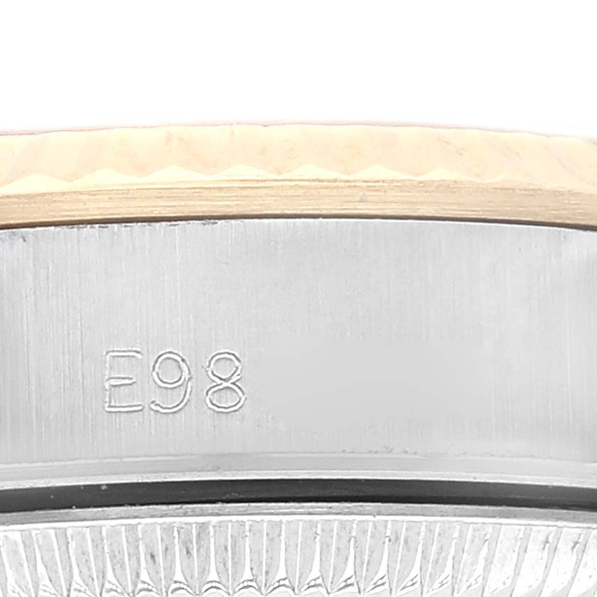 The image shows a close-up of the case side and bezel of a Rolex Oyster Perpetual 67193 Women's Steel and Gold (two tone) Champagne Dial 67193 Women's Steel and Gold (two tone) Champagne Dial watch, highlighting part of its serial number.
