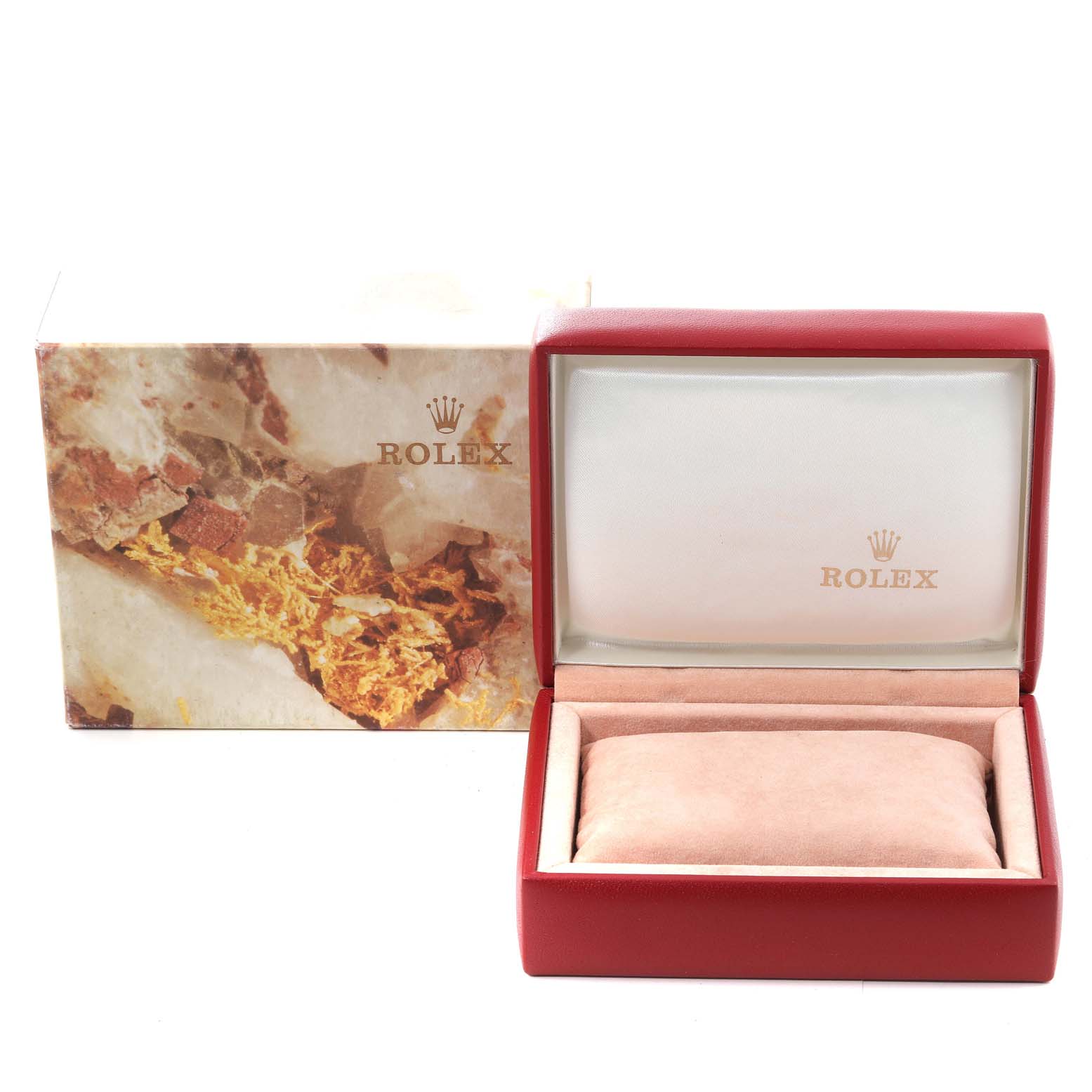 The image shows an open red Rolex box for the Oyster Perpetual model, highlighting the inner cushion and branding.