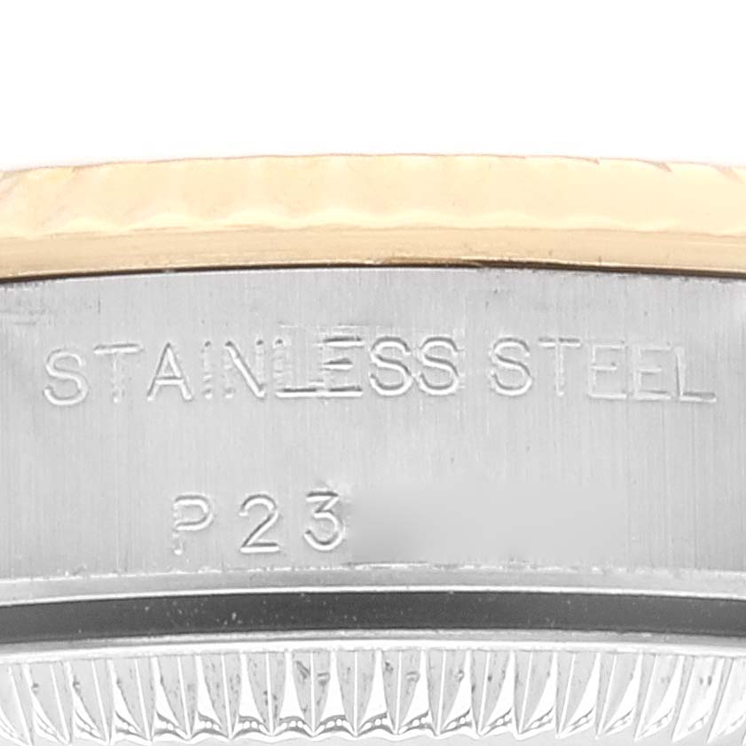 This image shows a close-up of the side of an Oyster Perpetual Rolex watch, highlighting the "Stainless Steel" engraving.