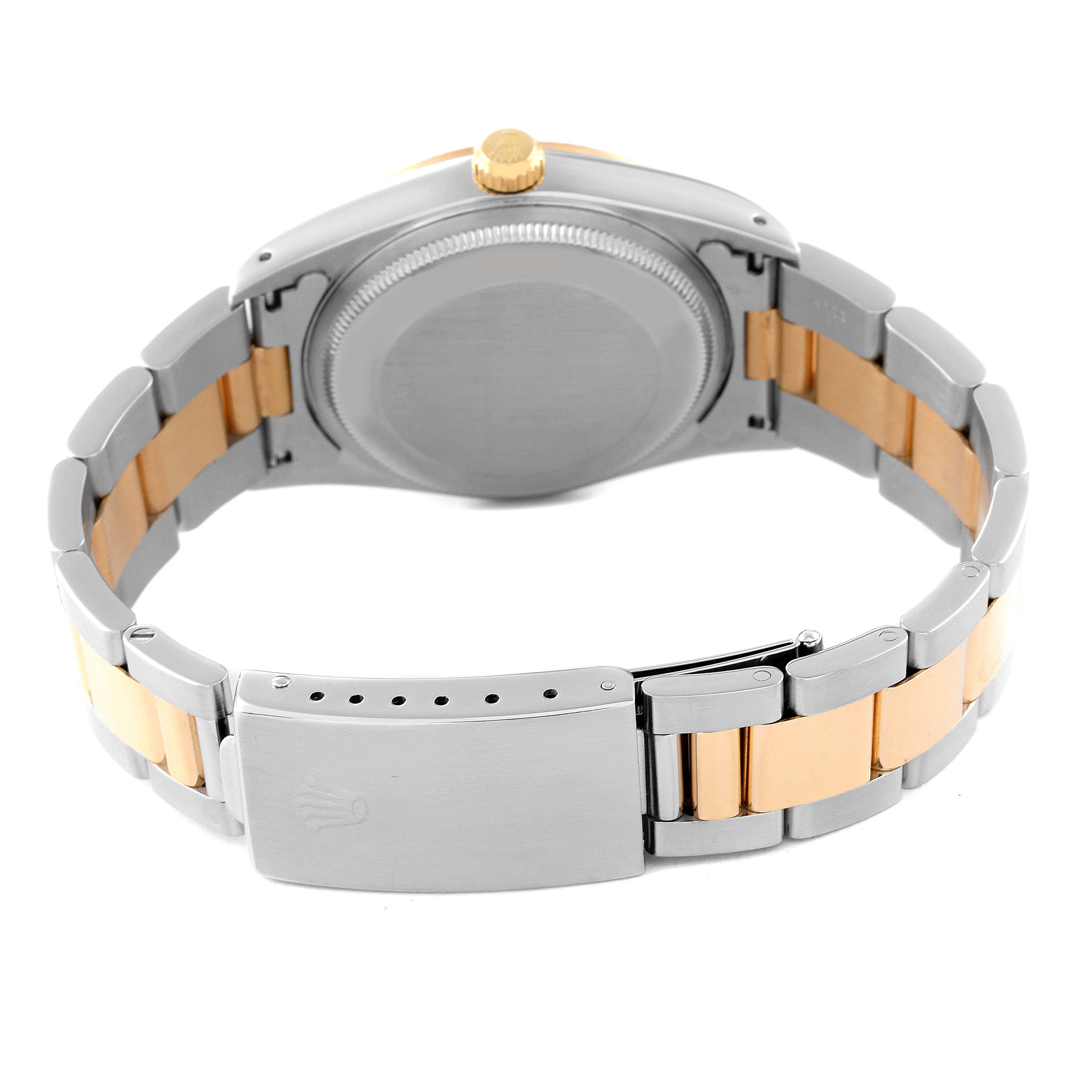 This image shows the back view of the case and the clasp of the Rolex Oyster Perpetual 14233 Men's Steel and Gold (two tone) White Dial 14233 Men's Steel and Gold (two tone) White Dial watch.