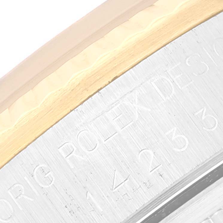 This close-up shows the engraved case back of the Rolex Oyster Perpetual 14233 Men's Steel and Gold (two tone) White Dial 14233 Men's Steel and Gold (two tone) White Dial watch, highlighting part of the model number.