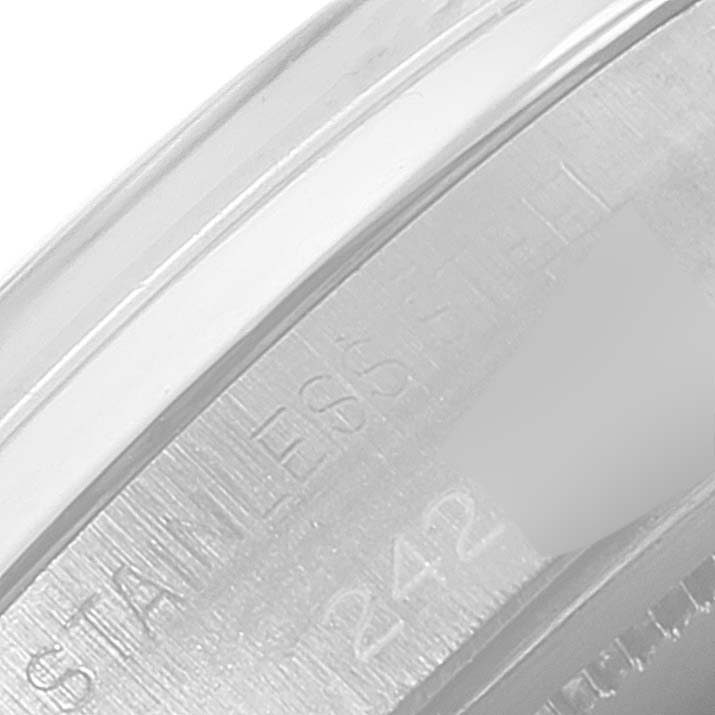 This close-up image shows the engraved inner bezel of a Rolex Date 6694 Men's Stainless Steel Silver Dial 6694 Men's Stainless Steel Silver Dial model watch, highlighting the "STAINLESS STEEL" text.