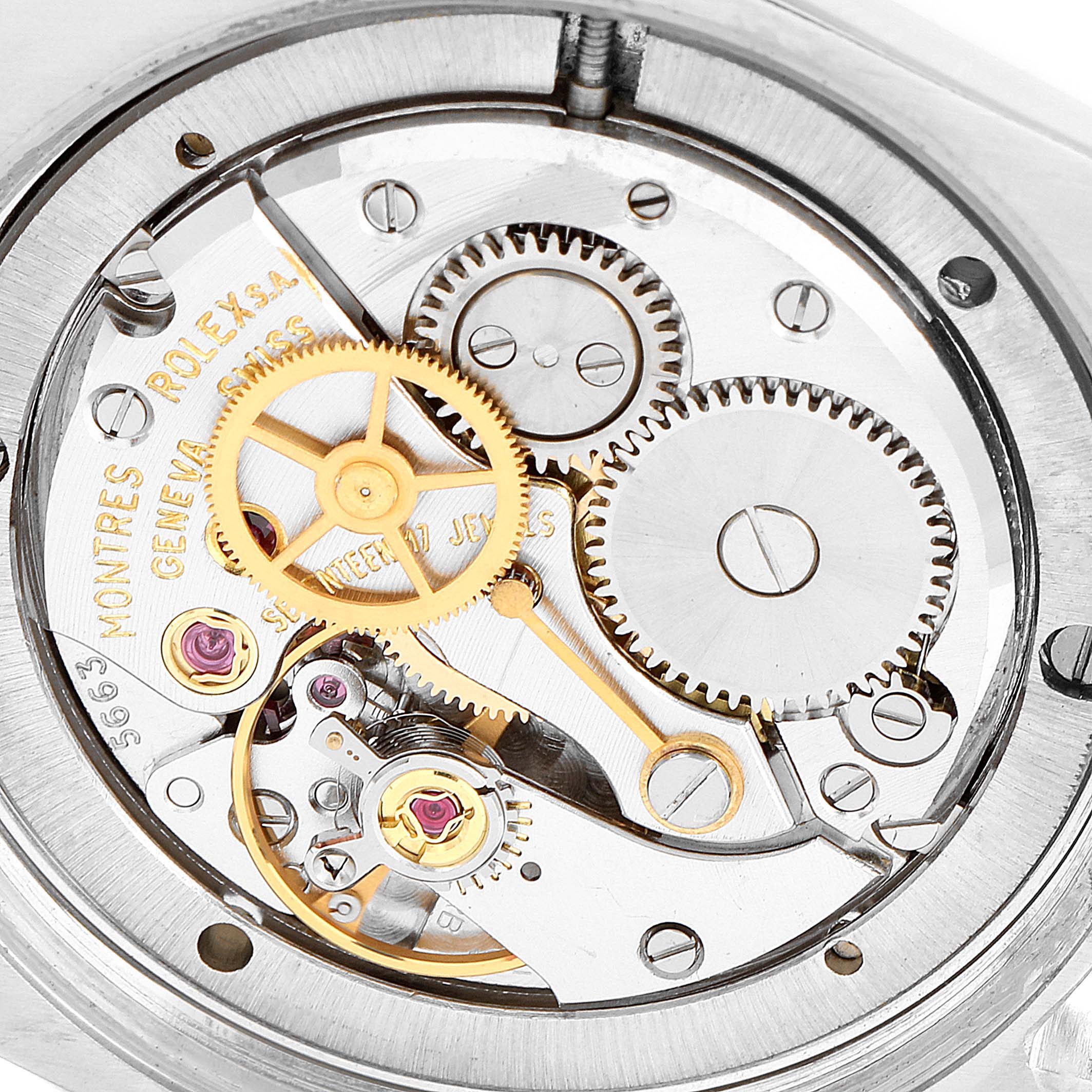 Close-up of the Rolex Date 6694 Men's Stainless Steel Silver Dial 6694 Men's Stainless Steel Silver Dial model watch showing its internal movement and gears.