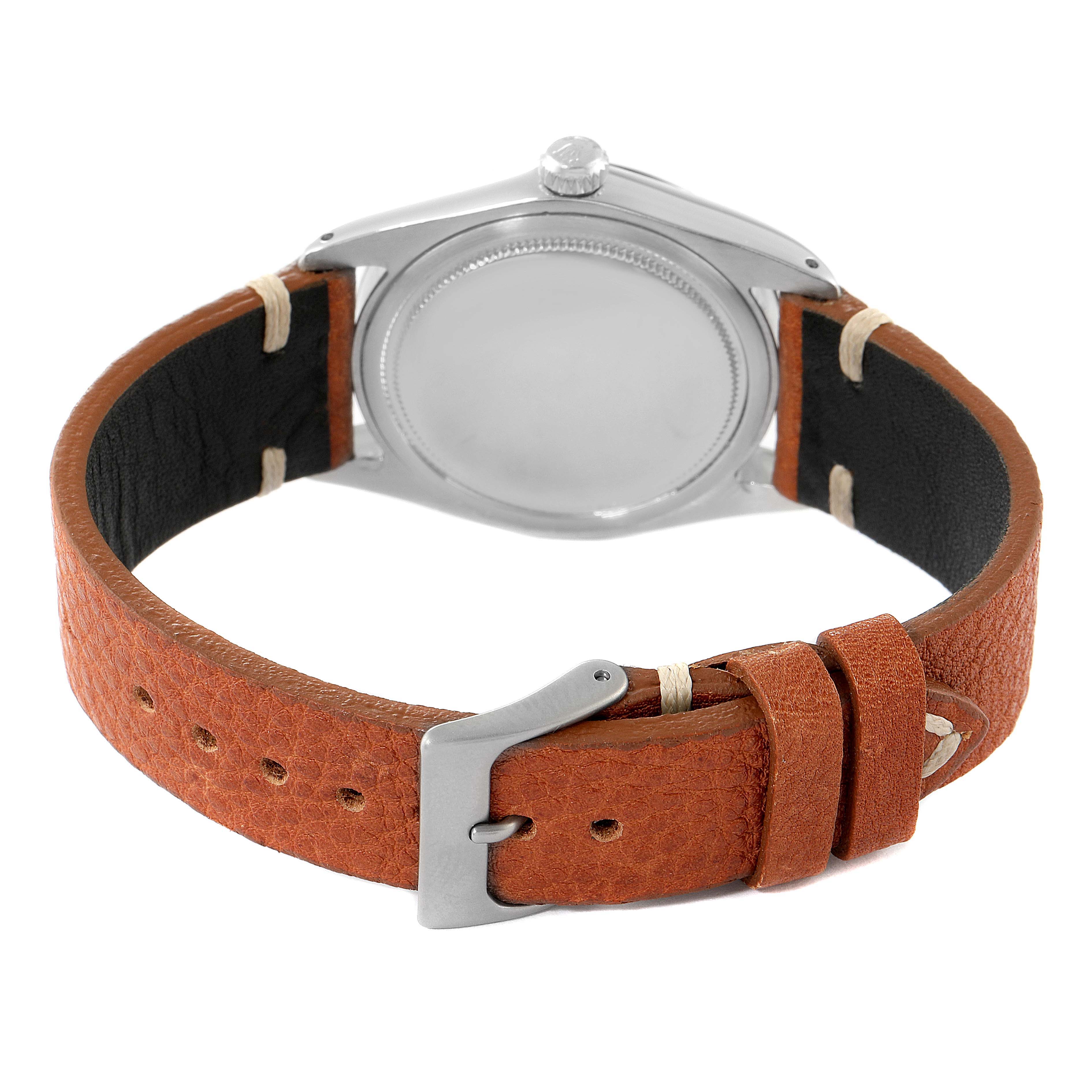 The image shows the back view of a Rolex Date 6694 Men's Stainless Steel Silver Dial 6694 Men's Stainless Steel Silver Dial model watch with a brown leather strap and a silver case.