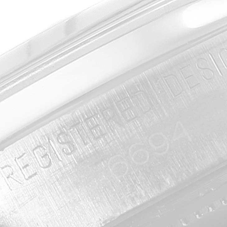This close-up image shows the engraved case back of a Rolex Date 6694 Men's Stainless Steel Silver Dial 6694 Men's Stainless Steel Silver Dial model, including part of the model number "6694."