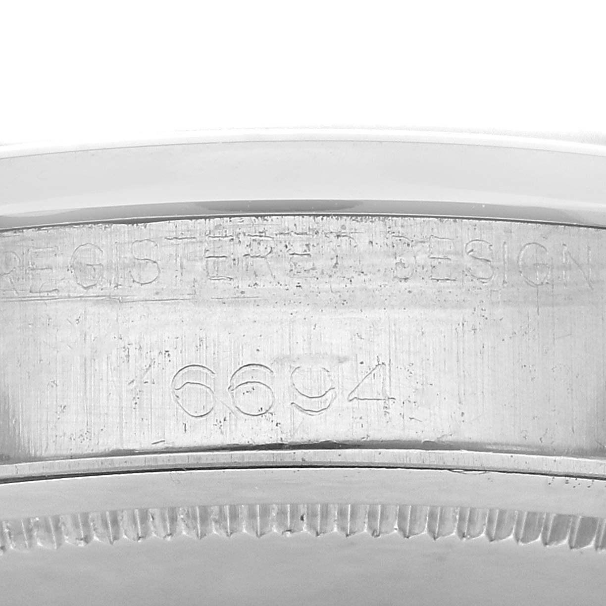 The image shows the side view of the case with the model number engraved on the Rolex Vintage Collection 6694 Men's Stainless Steel Silver Dial 6694 Men's Stainless Steel Silver Dial watch.