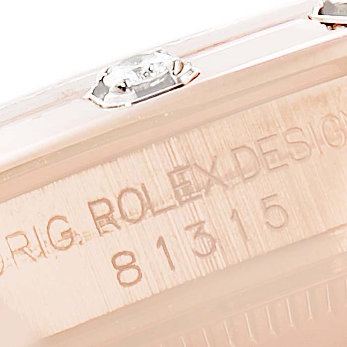This close-up image shows the etched side and serial number of the Rolex Pearlmaster 81315 Women
s Rose Gold Brown Dial 81315 Women
s Rose Gold Brown Dial watch case.