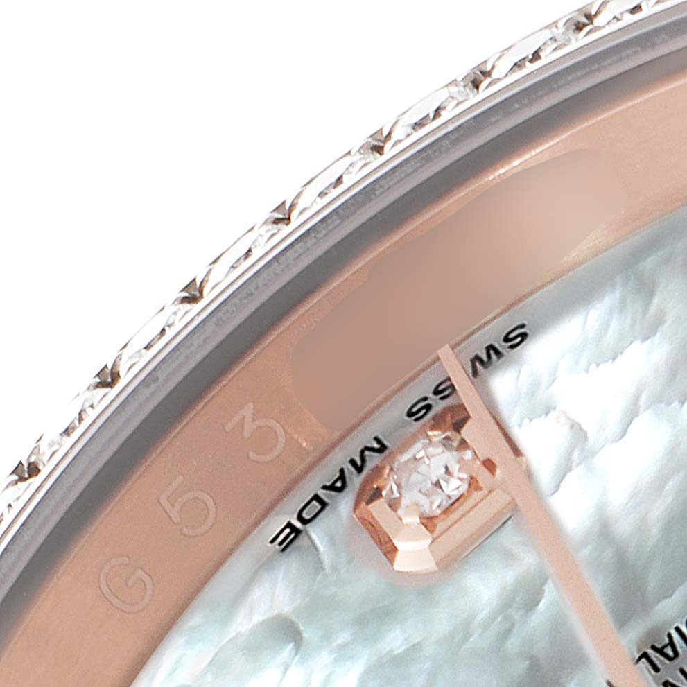 This close-up angle shows the bezel, part of the dial, and the diamond marker of a Rolex Datejust 116185 Men's Rose Gold Mother of Pearl Dial 116185 Men's Rose Gold Mother of Pearl Dial watch.