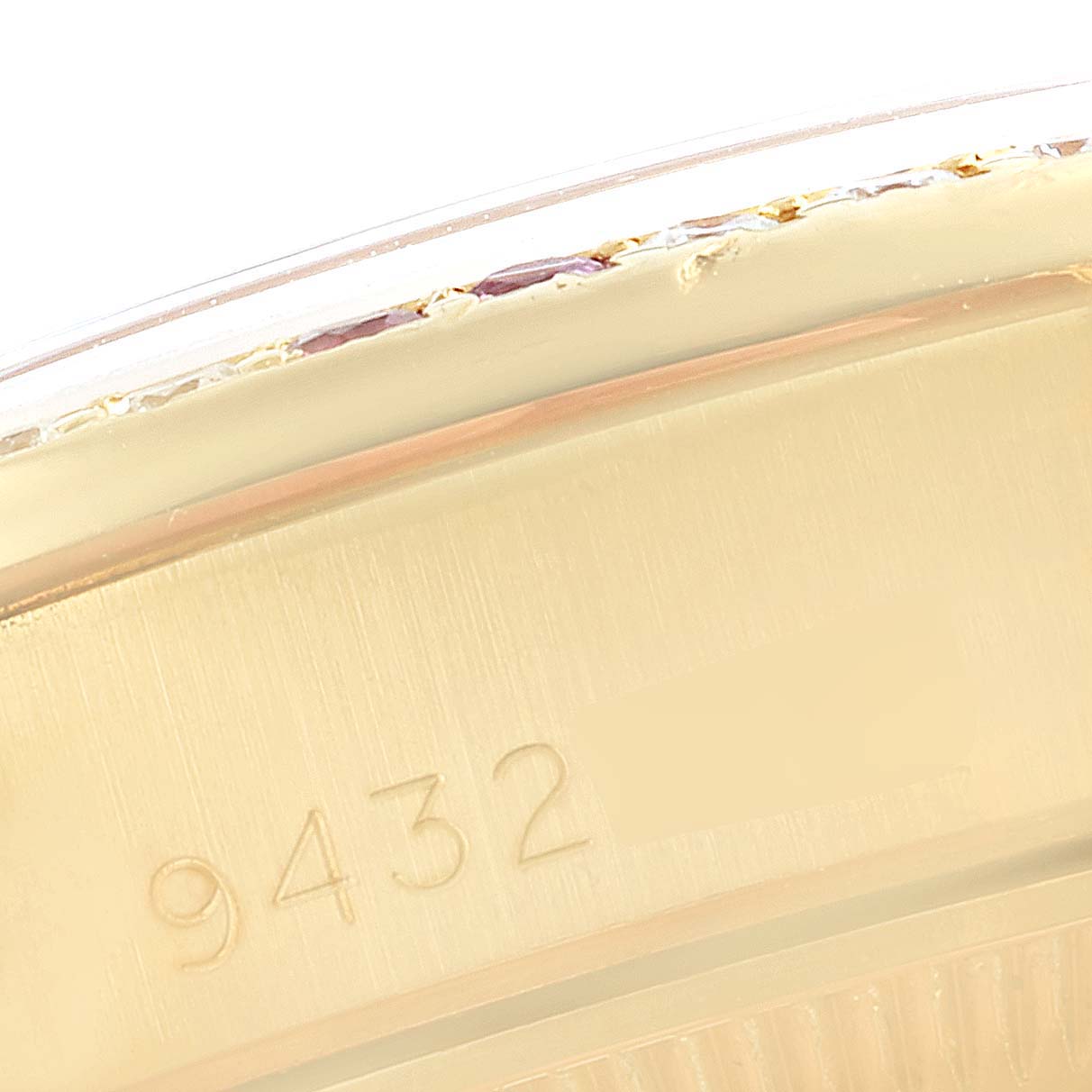 This close-up image shows the serial number on the side of the Rolex President 69038 Women's Yellow Gold Champagne Dial 69038 Women's Yellow Gold Champagne Dial model watch.