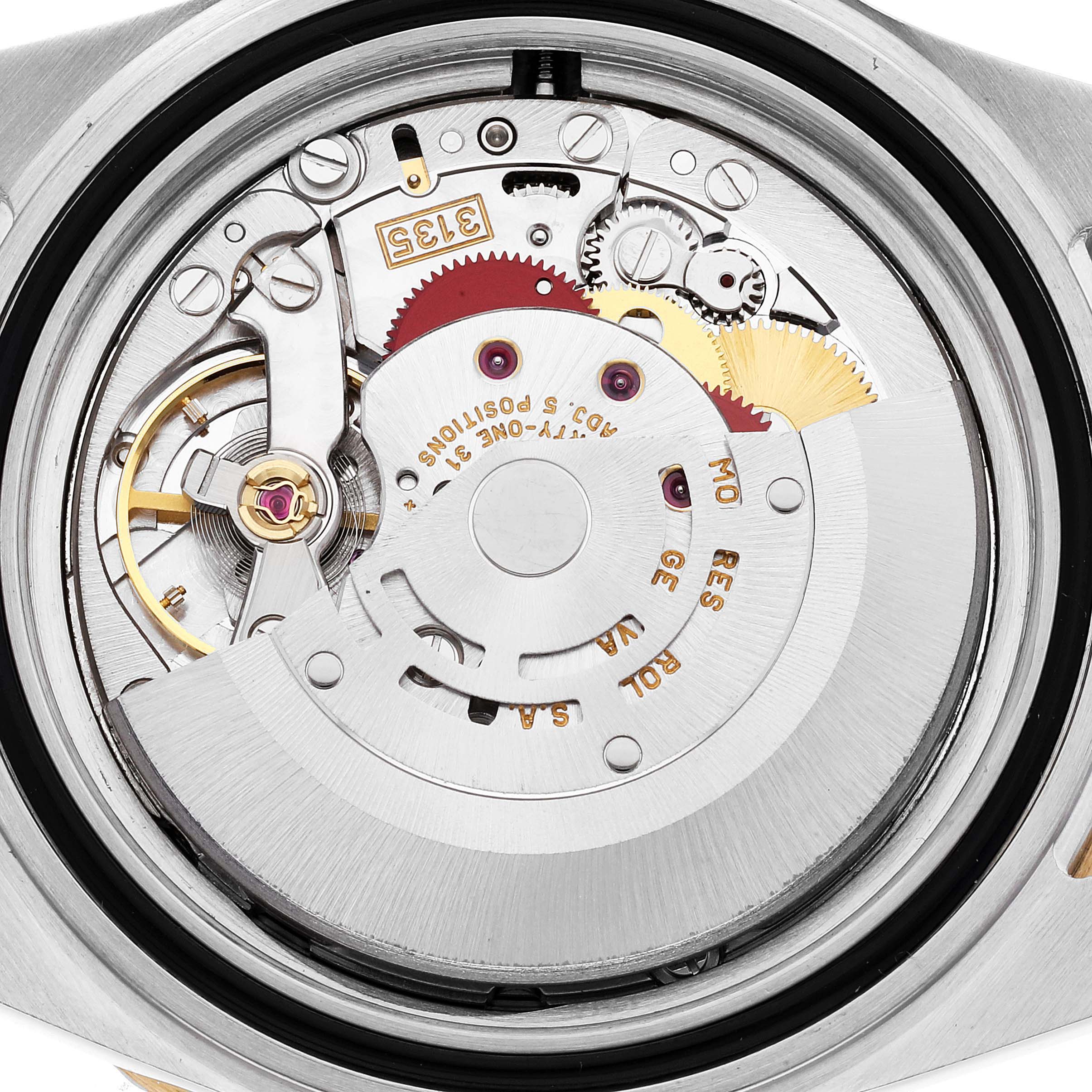 This is an image of the Rolex Submariner 16613 Men's Steel and Gold (two tone) Blue Dial 16613 Men's Steel and Gold (two tone) Blue Dial watch's movement, showing its intricate internal mechanism from the back.